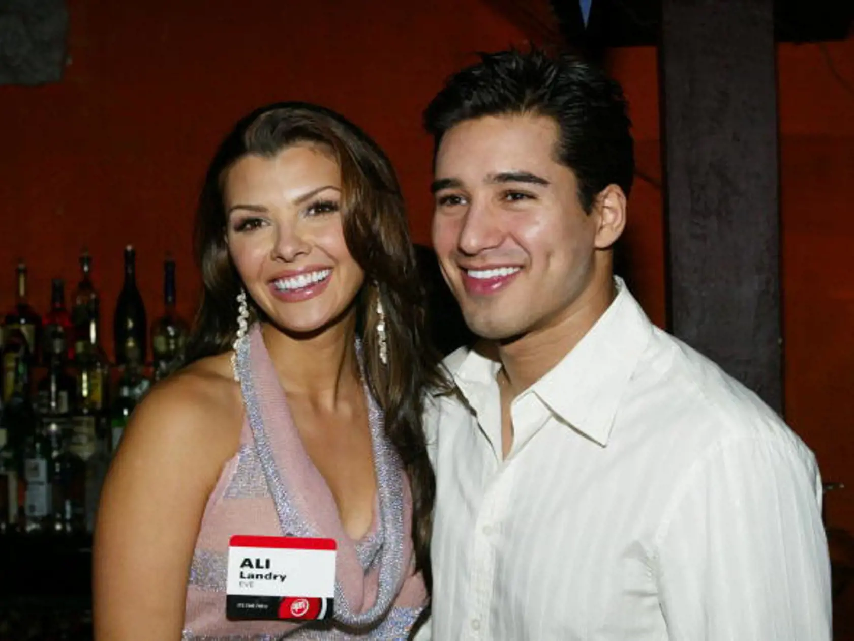 HOLLYWOOD, CA - JANUARY 17:  (L to R) Actors Ali Landry and Mario Lopez attend the CBS/UPN's Super Bowl XXXVIII Party during the 2004 Winter Press Tour at the Avalon Hollywood in Hollywood, California.  (Photo by Frederick M. Brown/Getty Images).