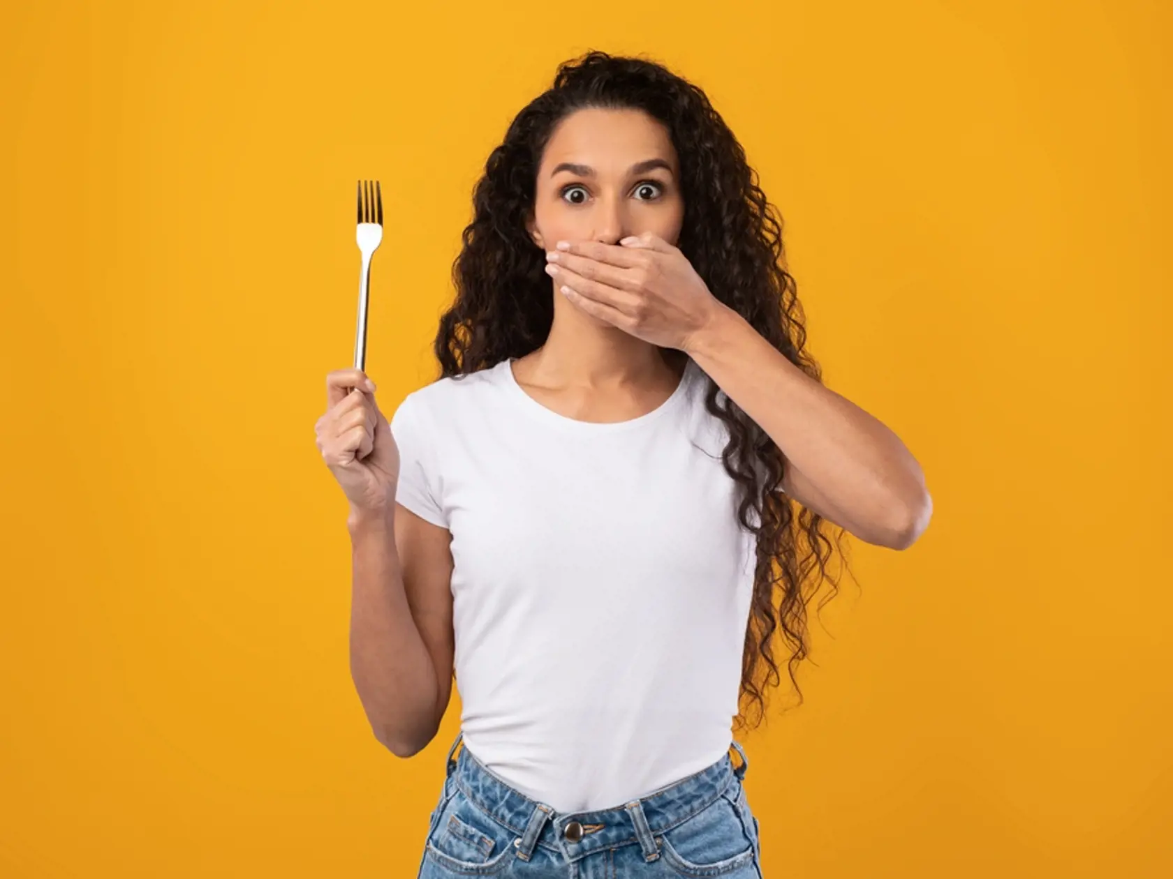 Portrait,Of,Young,Scared,Latin,Woman,With,Curly,Hair,Holding