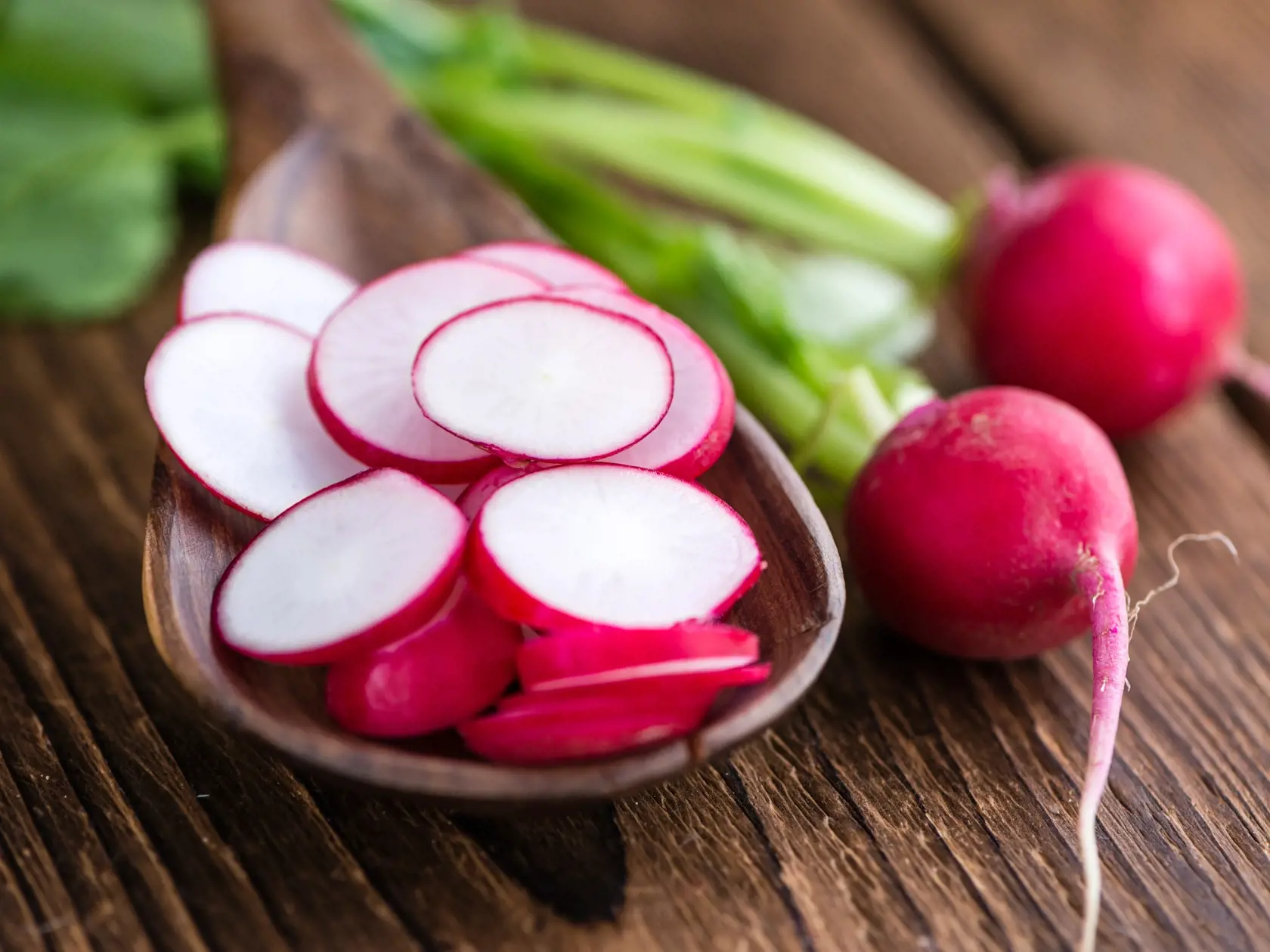 Sliced,Radishes,(selective,Focus),On,Wooden,Background,(close-up,Shot)
