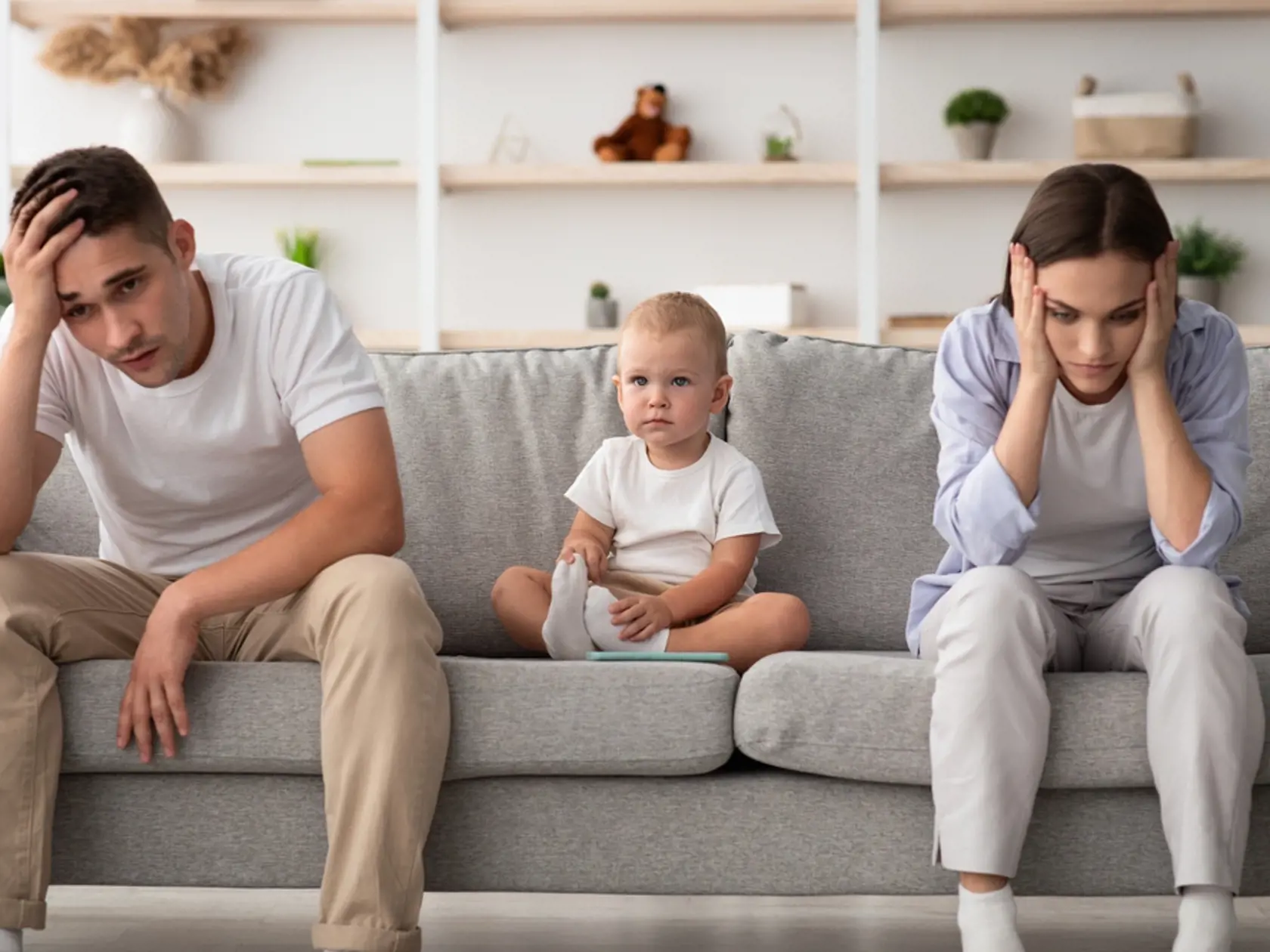 Family,Conflicts.,Cute,Infant,Baby,Sitting,Between,Offended,Parents,After