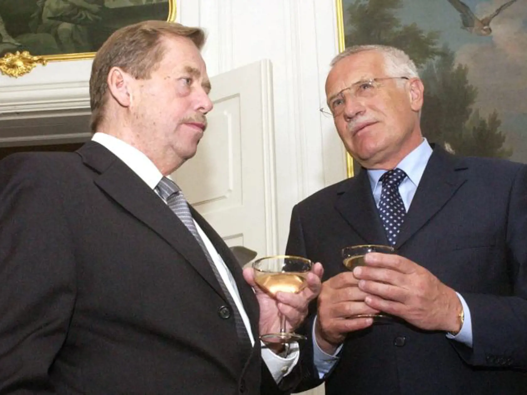Czech President Vaclav Havel, left, and Czech Parliament Chamber of Deputies and Civic Democratic Party (ODS) Chairman Vaclav Klaus, right, during a reception marking the end of the lower house of Czech Parliament four-year term at Lany Castle, Central Bohemia, Czech Republic, on Thursday, June 13, 2002. The centre-right Civic Democrats are polling around 28 percent against 30 percent of the Czech Social Democrats before the June 14-15 general election in the Czech Republic.  (AP Photo/Stanislav
