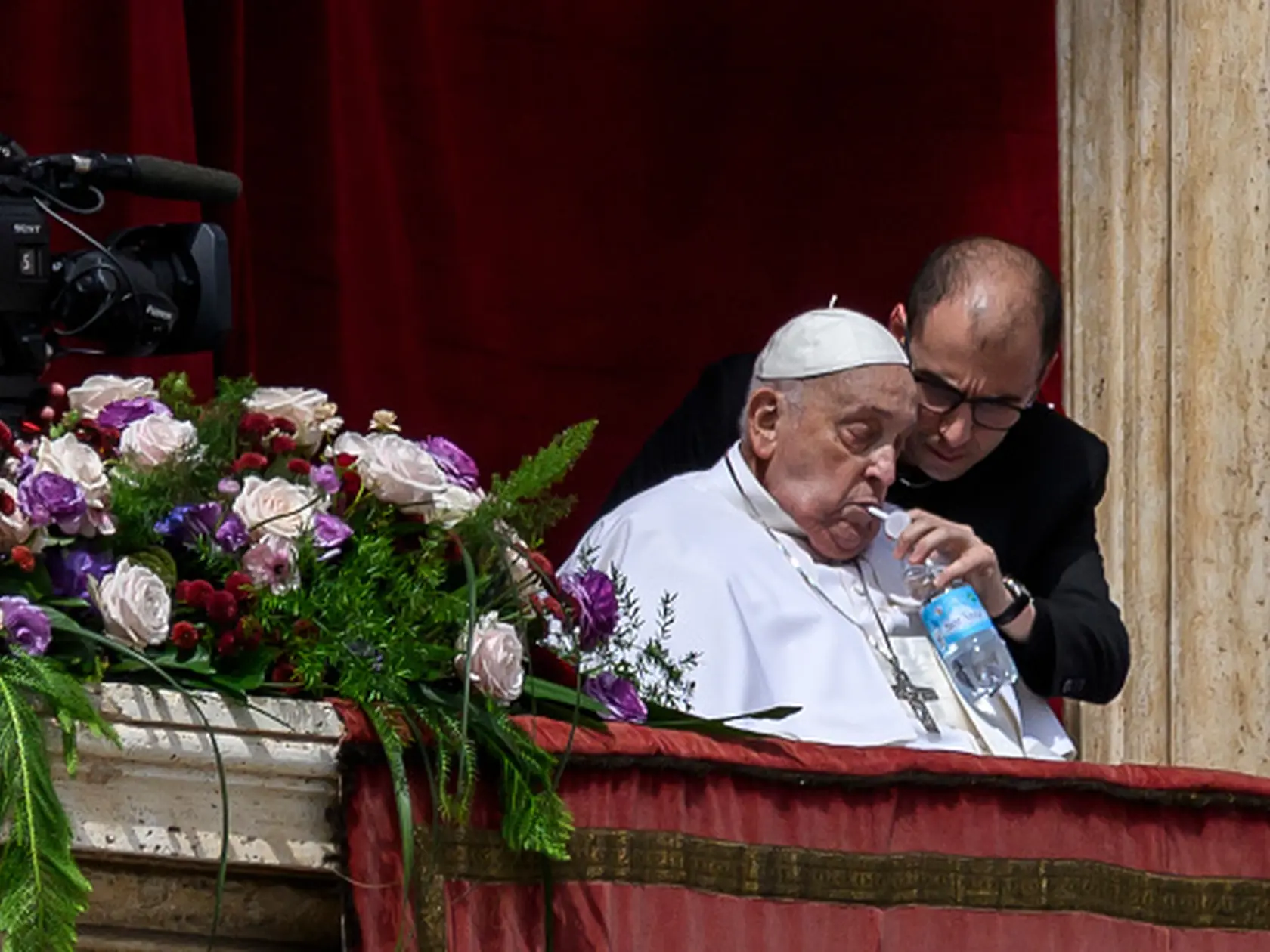 VATICAN CITY, VATICAN - APRIL 20: Pope Francis sips water with a straw on the main balcony of St. Peter's basilica during the Urbi et Orbi blessing at St Peter's square on April 20, 2025 in Vatican City, Vatican. (Photo by Antonio Masiello/Getty Images)