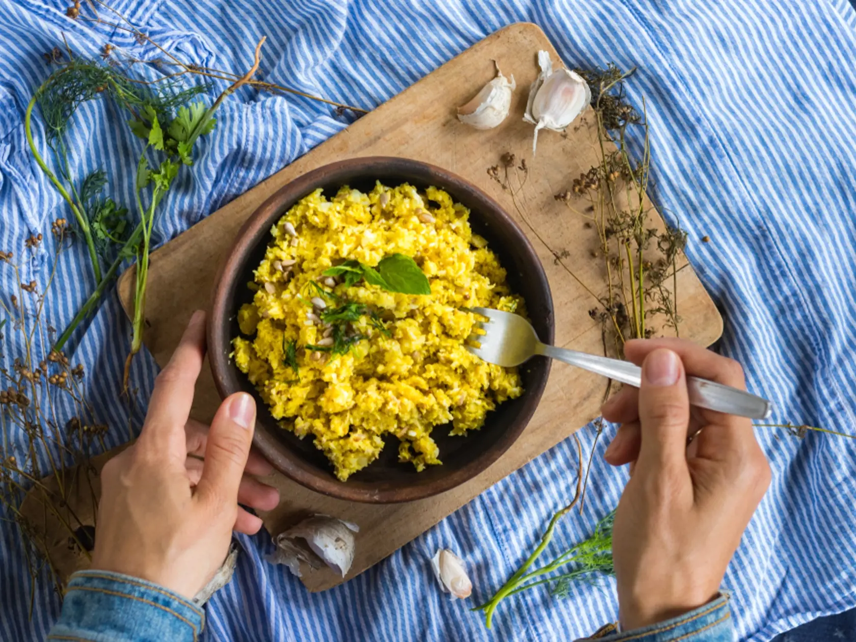 Woman,Hands,Holdsvegan,Raw,Cauliflower,Rice,Porridge,Mixed,And,Dressed