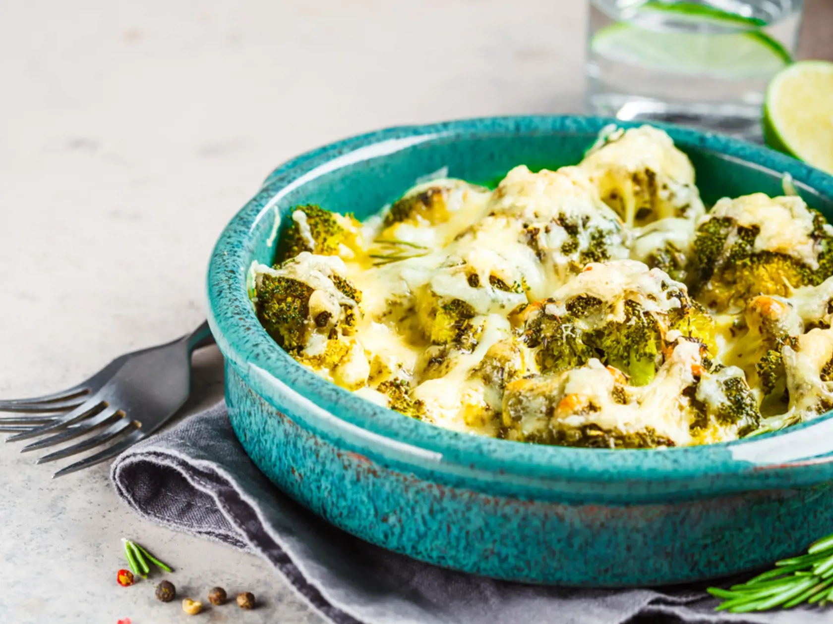 Broccoli,Casserole,With,Cheese,In,Blue,Dish,,Gray,Background.,Vegetarian