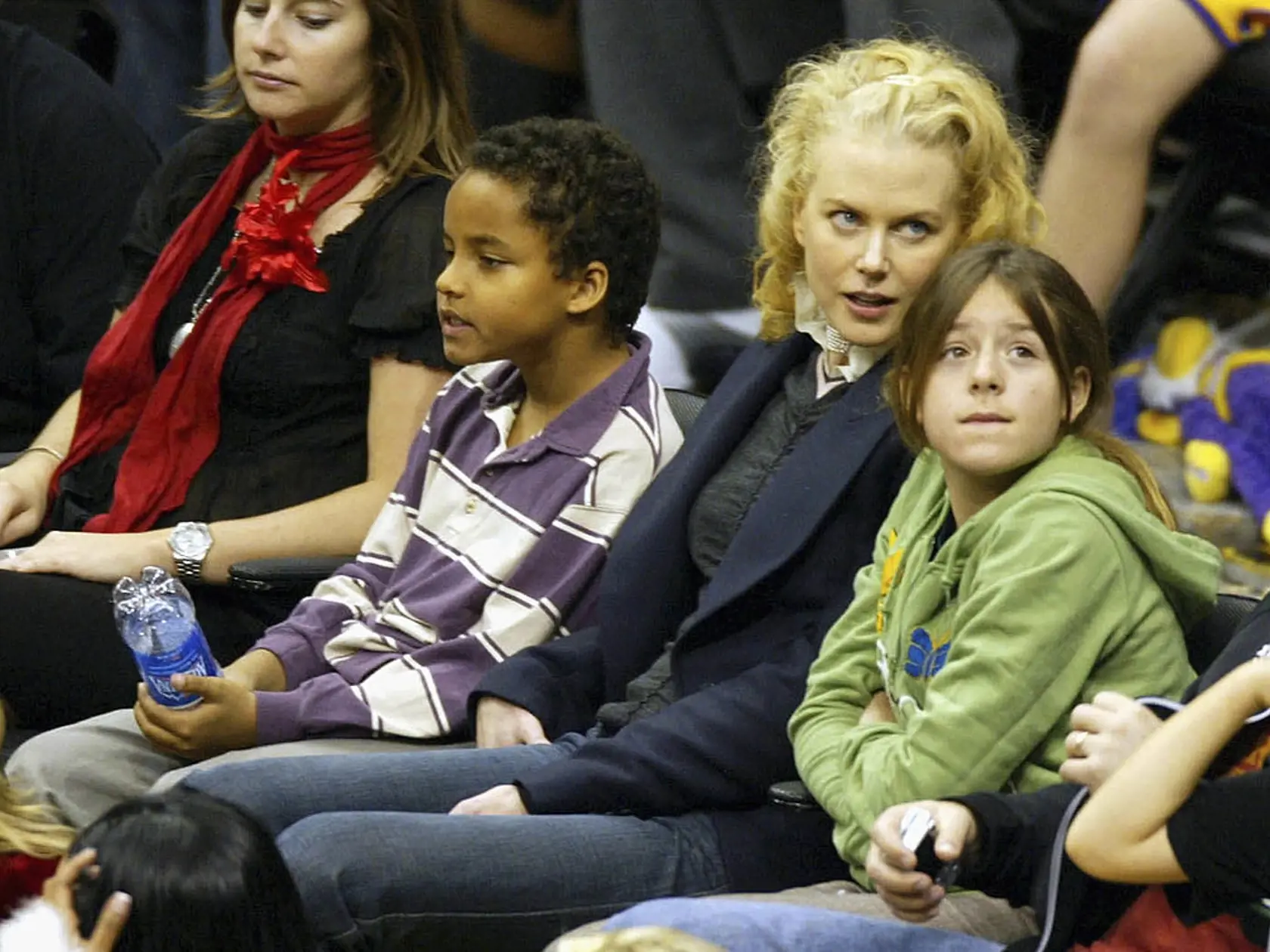 LOS ANGELES - DECEMBER 25: Actress Nicole Kidman (C) and her children Connor (2nd-L) and Isabella (2nd-R) attend a game between the Los Angeles Lakers and the Miami Heat at the Staples Center December 25, 2004 in Los Angeles, California. (Photo by Matthew Simmons/Getty Images)  
