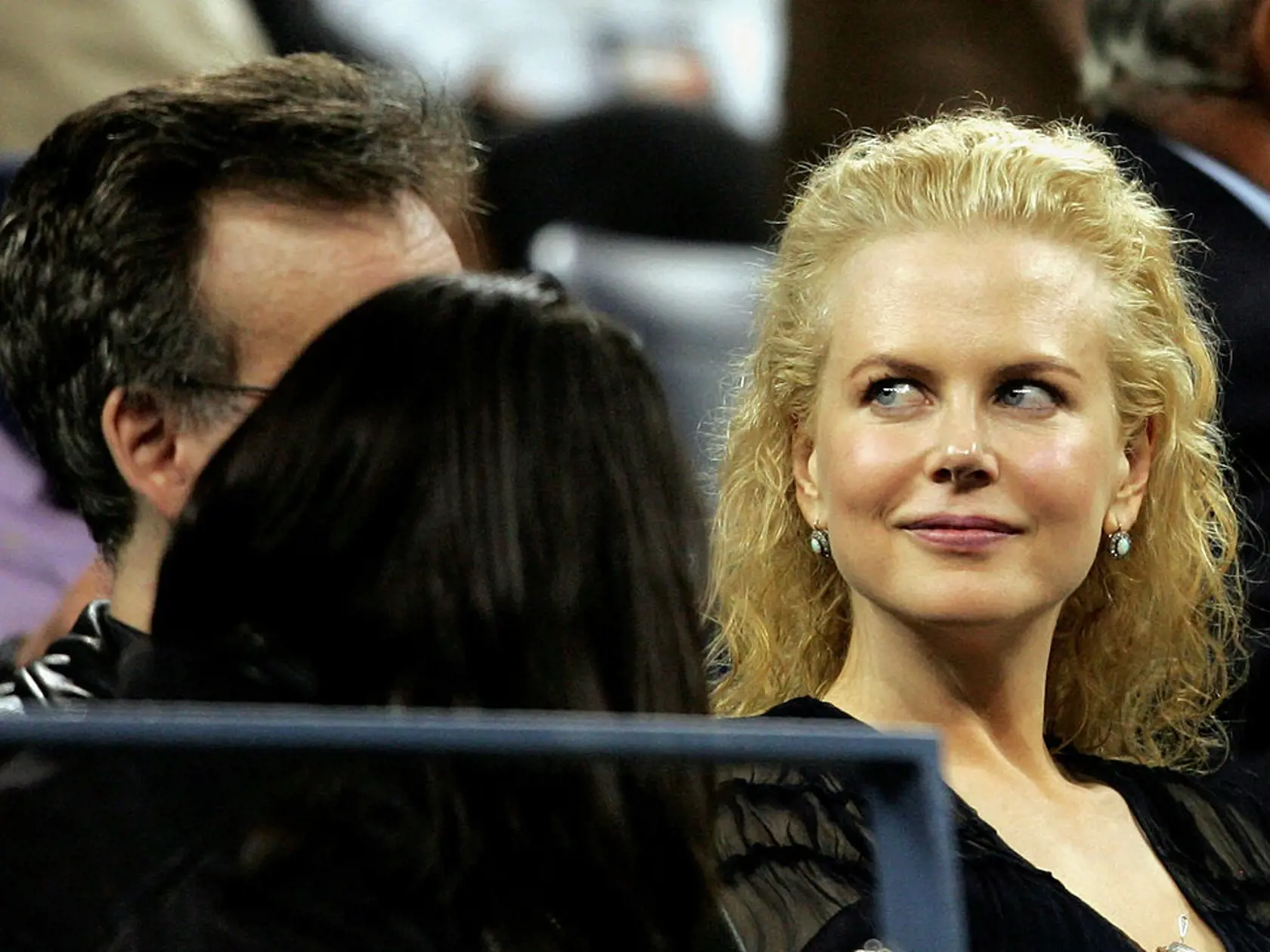 NEW YORK - SEPTEMBER 07:  Actress Nicole Kidman sits in the stands during quarterfinal matches on Day 10 of the US Open at the USTA National Tennis Center in Flushing Meadows Corona Park on September 7, 2005 in the Flushing neighborhood of the Queens borough of New York City.  (Photo by Matthew Stockman/Getty Images)