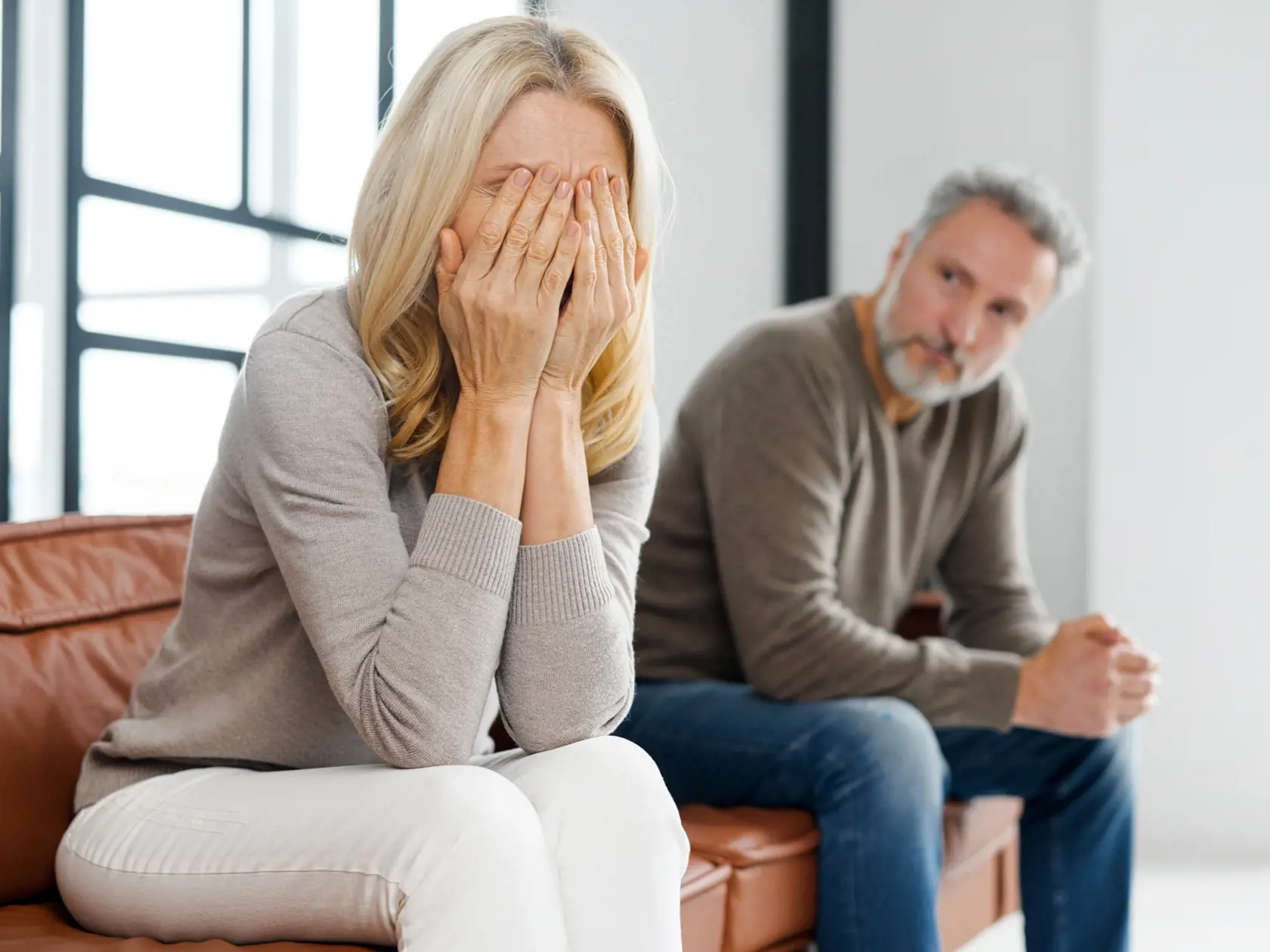 Upset,Middle-aged,Couple,Is,Arguing,At,Home,,Frustrated,Blonde,Woman