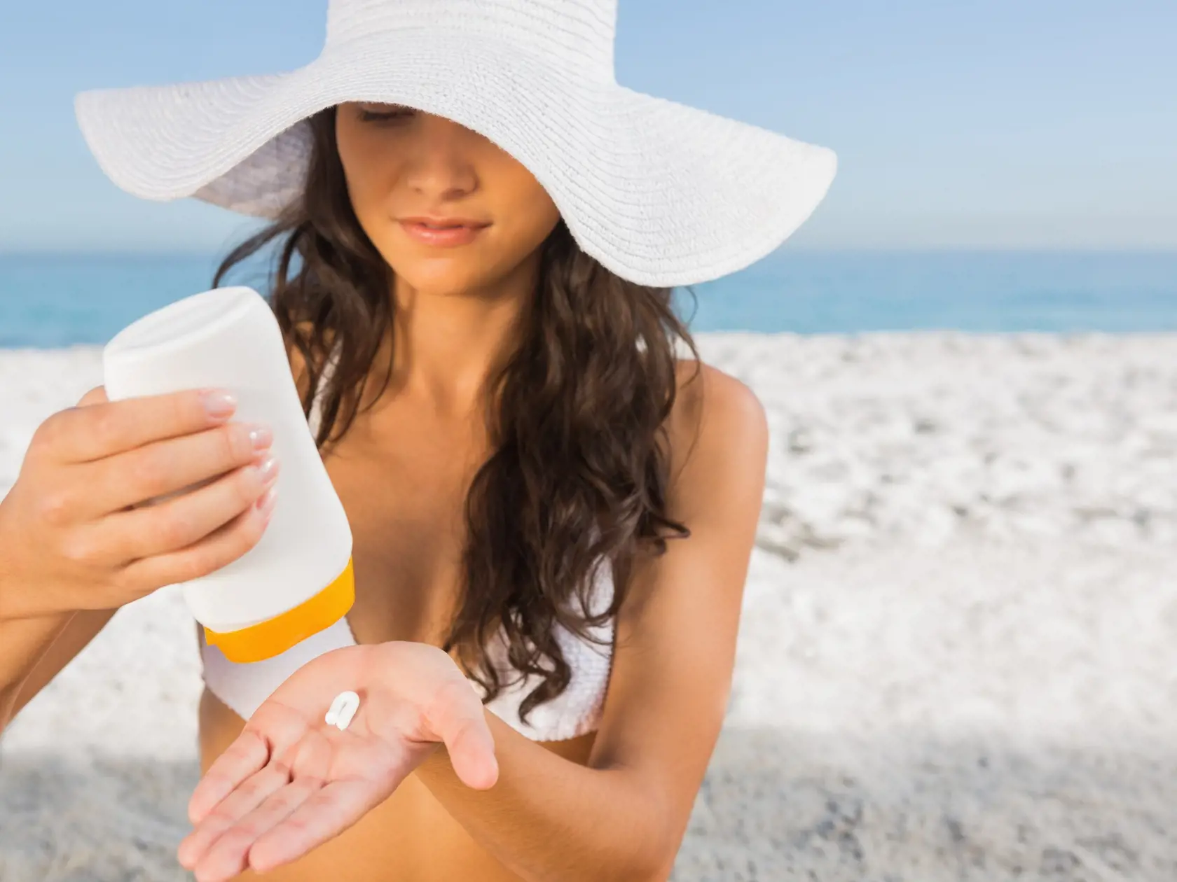 Sexy,Young,Brunette,On,The,Beach,Taking,Care,Of,Her