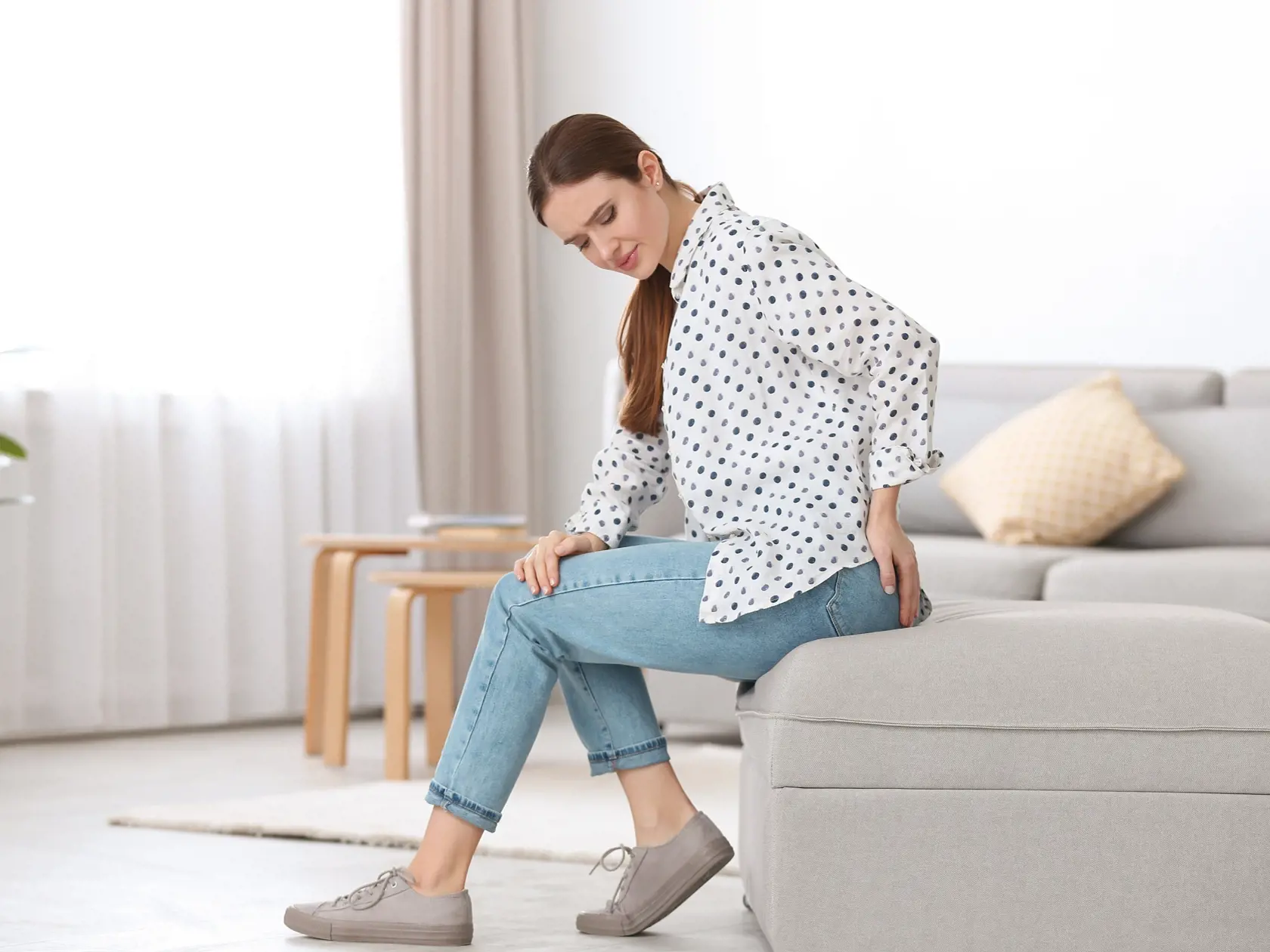 Young,Woman,Suffering,From,Hemorrhoid,At,Home
