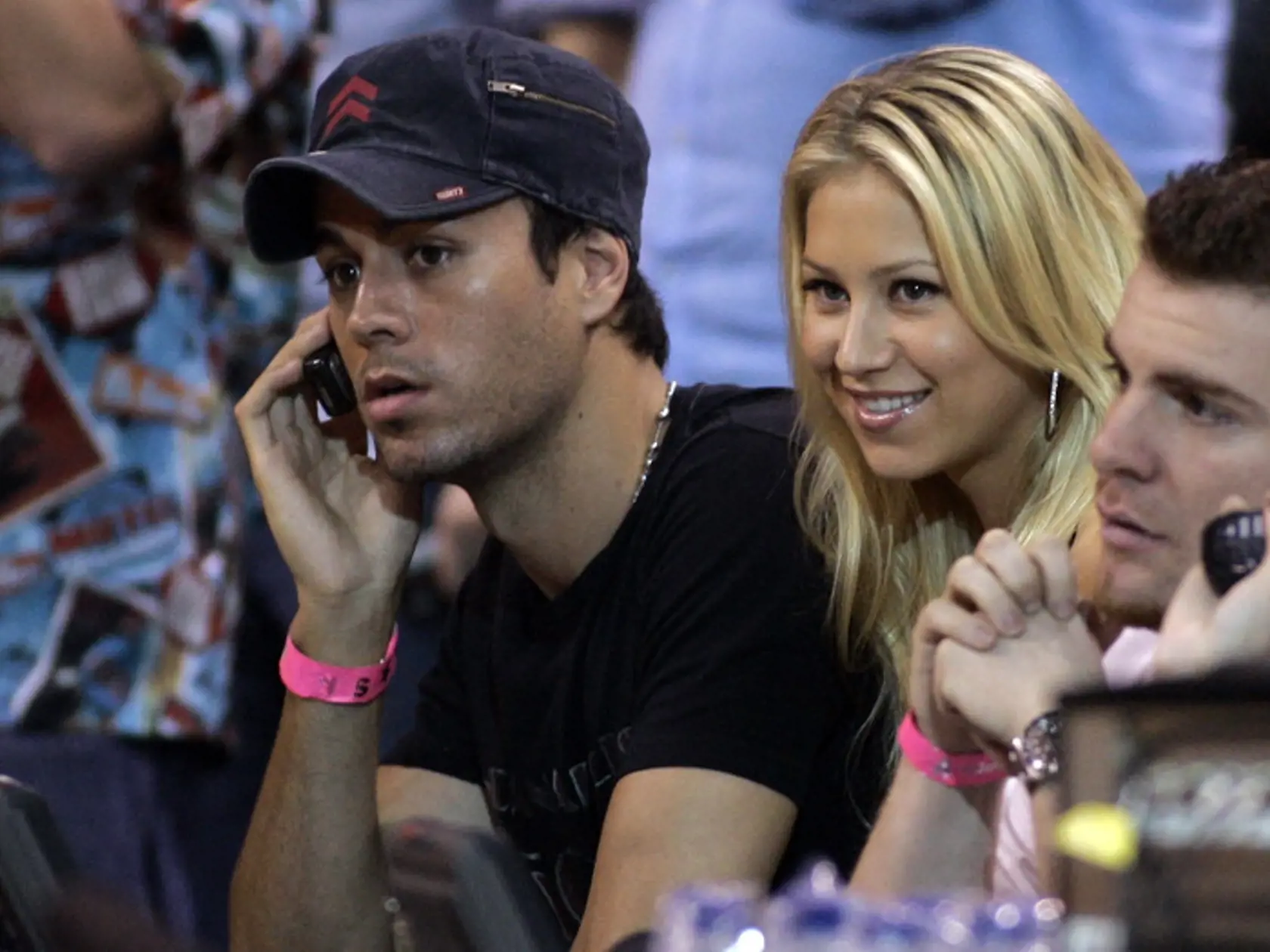 Enrique Iglesias, left, and his wife Anna Kournikova, second from left, watch the game between the Miami Heat and the Cleveland Cavaliers of a basketball game in Miami, Thursday, Feb. 1, 2007. The Heat won, 92-89. (AP Photo/Alan Diaz)