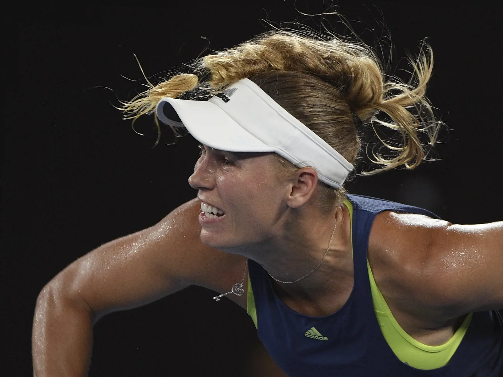 Denmark's Caroline Wozniacki serves to Romania's Simona Halep during the women's singles final at the Australian Open tennis championships in Melbourne, Australia, Saturday, Jan. 27, 2018. (AP Photo/Andy Brownbill)