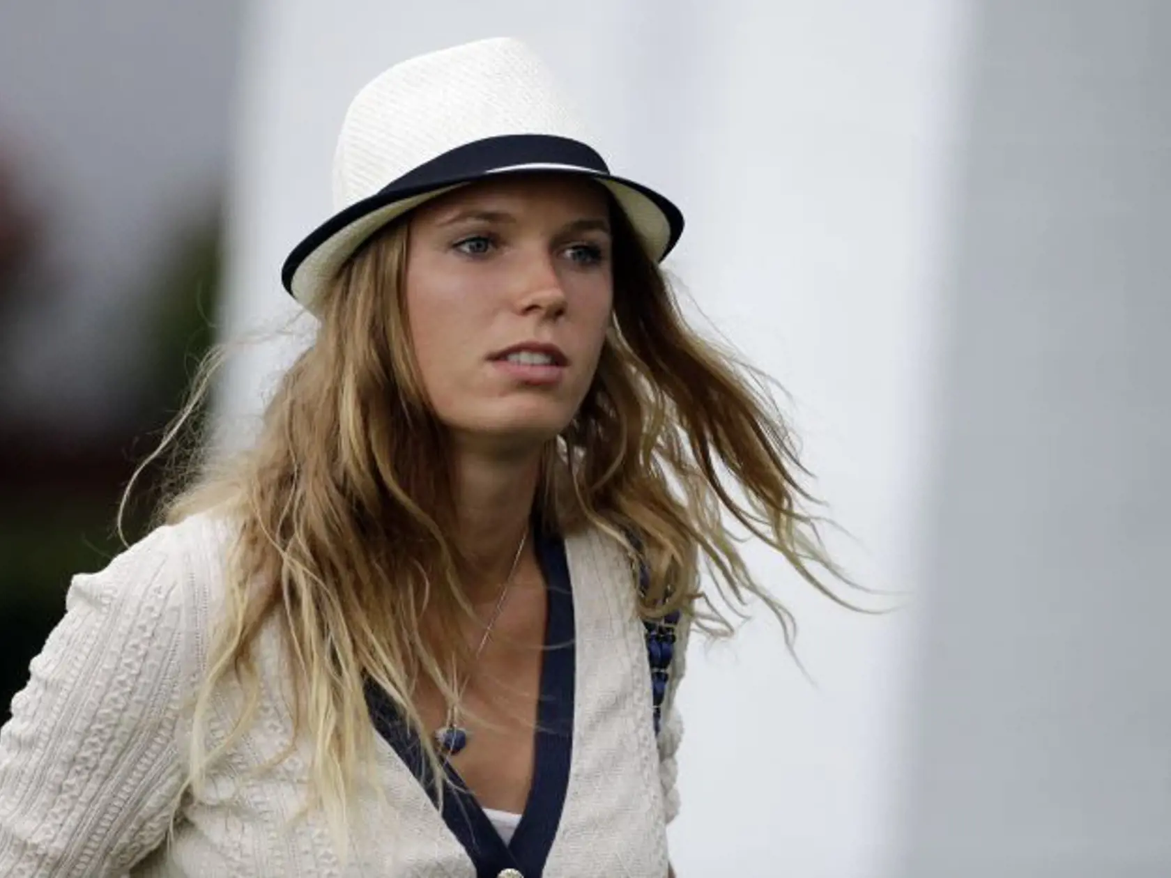 Tennis player Caroline Wozniacki leaves after watching Rory McIlroy, of Northern Ireland, during the first round of the Masters golf tournament Thursday, April 11, 2013, in Augusta, Ga. (AP Photo/David Goldman)