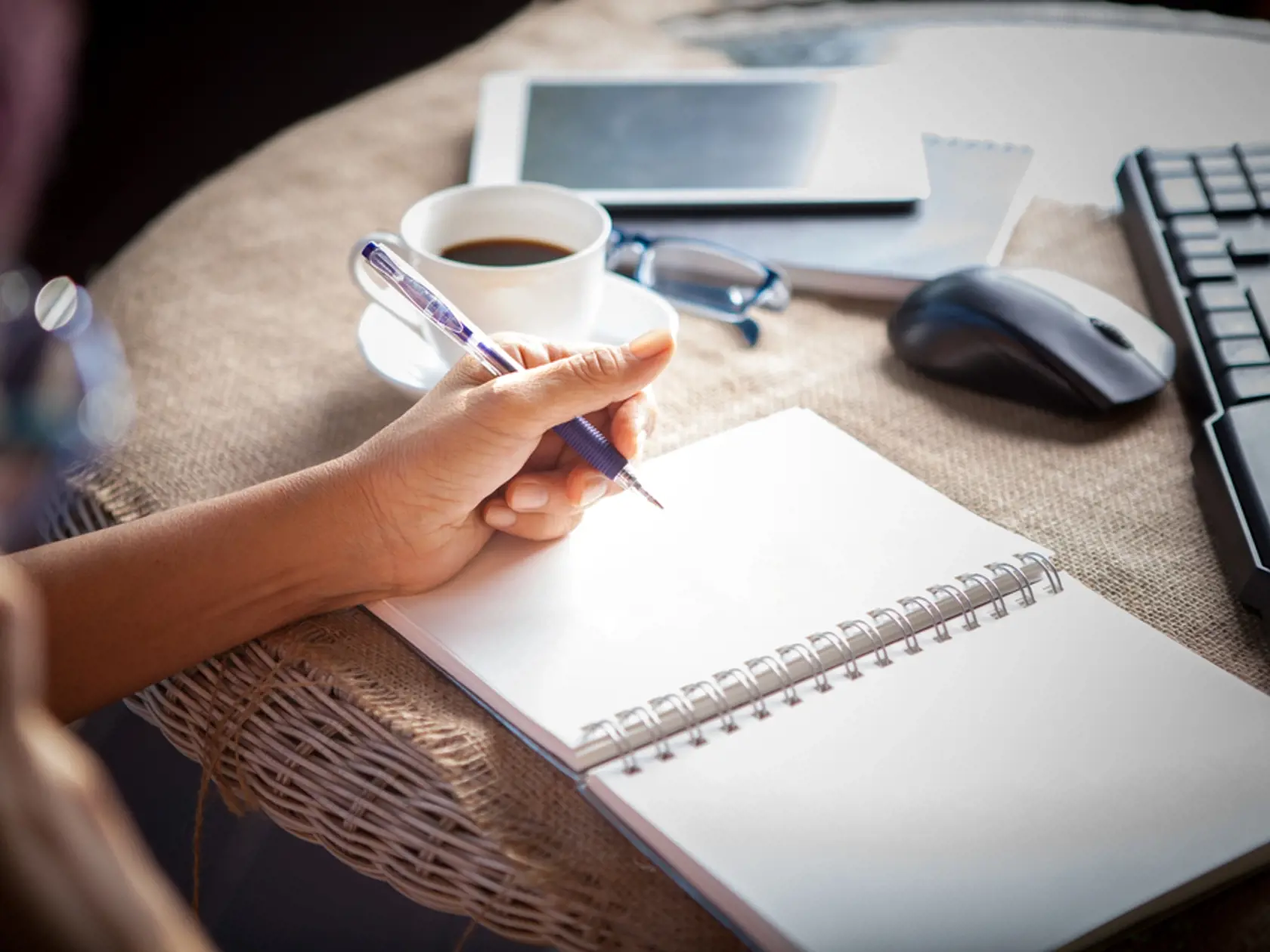 Woman,Left,Hand,Writing,On,Paper,Book,,on,Table,Shot
