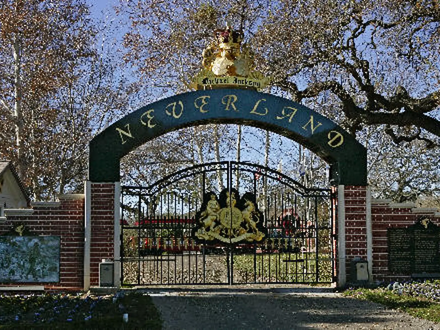 ** FILE ** The entrance to pop star Michael Jackson's Neverland Ranch home is seen in this Dec. 17, 2004, file photo, in Santa Ynez, Calif. The state barred workers from Jackson's Neverland Ranch Thursday, March 9, 2006, and fined the singer $69,000 because the estate's workers compensation insurance policy had lapsed. (AP Photo/Mark J. Terrill, File)