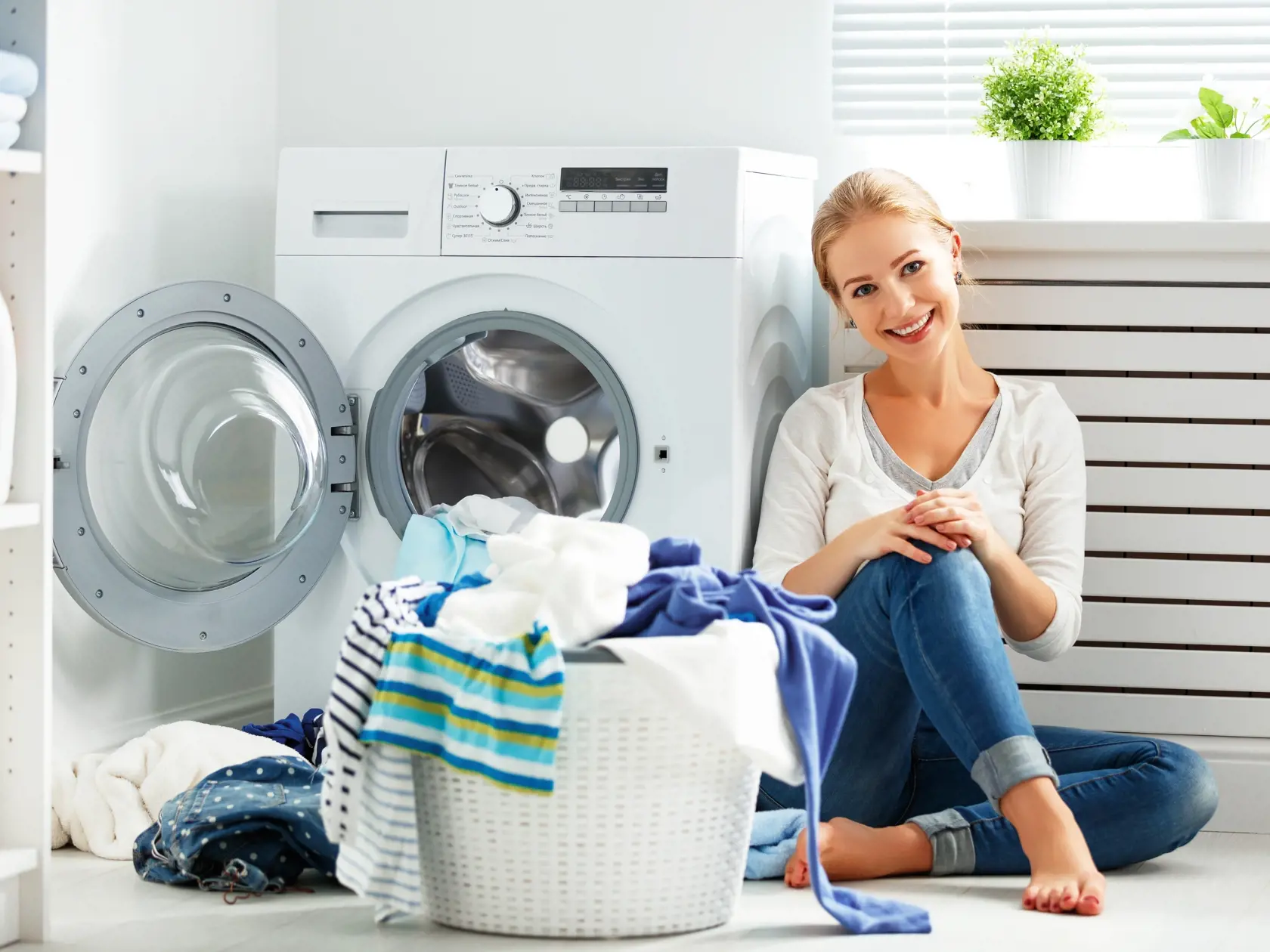 Happy,Woman,Housewife,In,The,Laundry,Room,Near,The,Washing