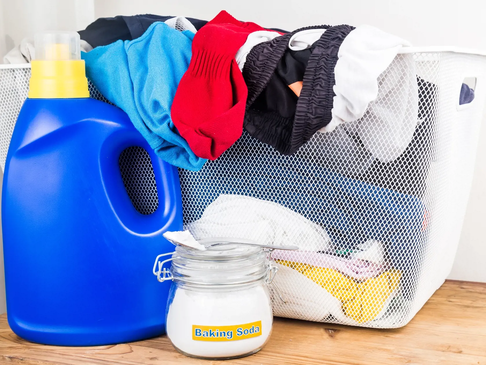 Baking,Soda,With,Detergent,And,Pile,Of,Dirty,Laundry