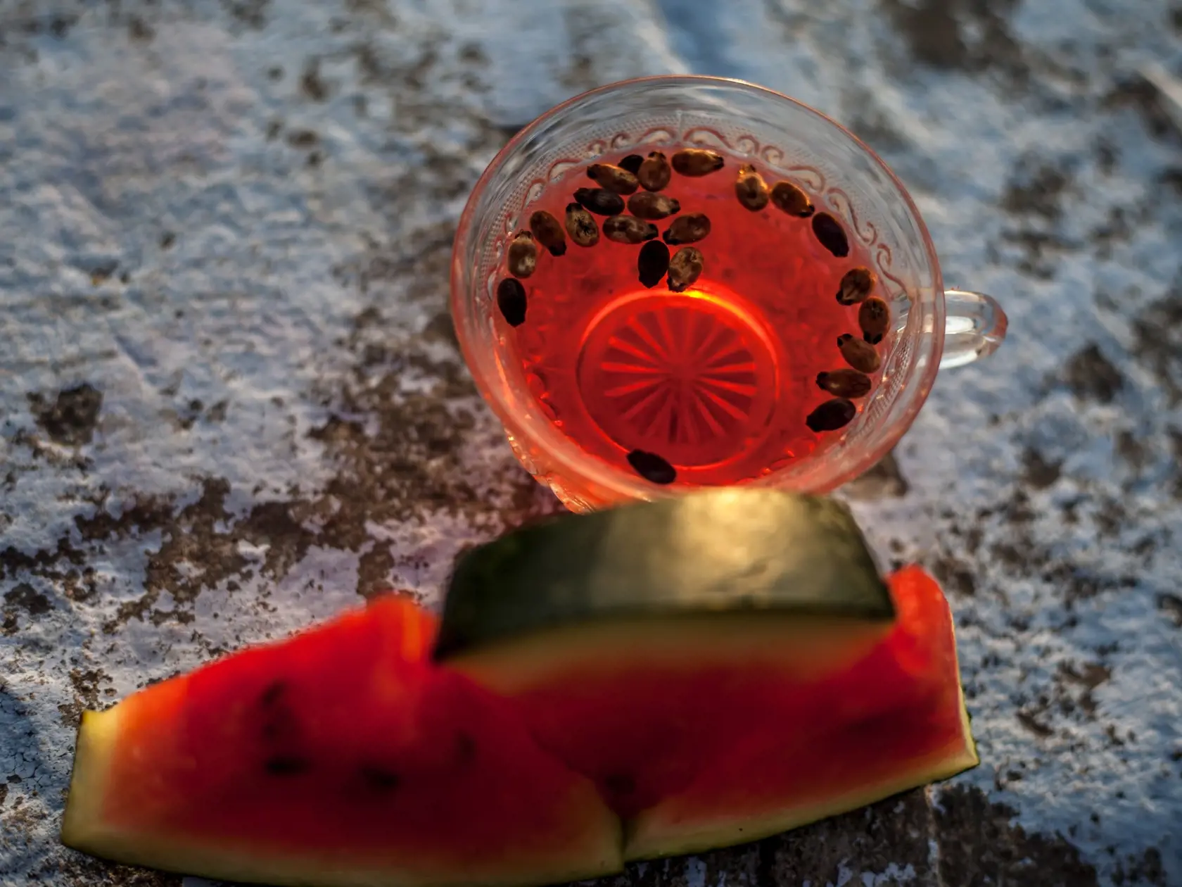 Watermelon,Seeds,Tea,In,A,Transparent,Glass,Cup,On,Rough