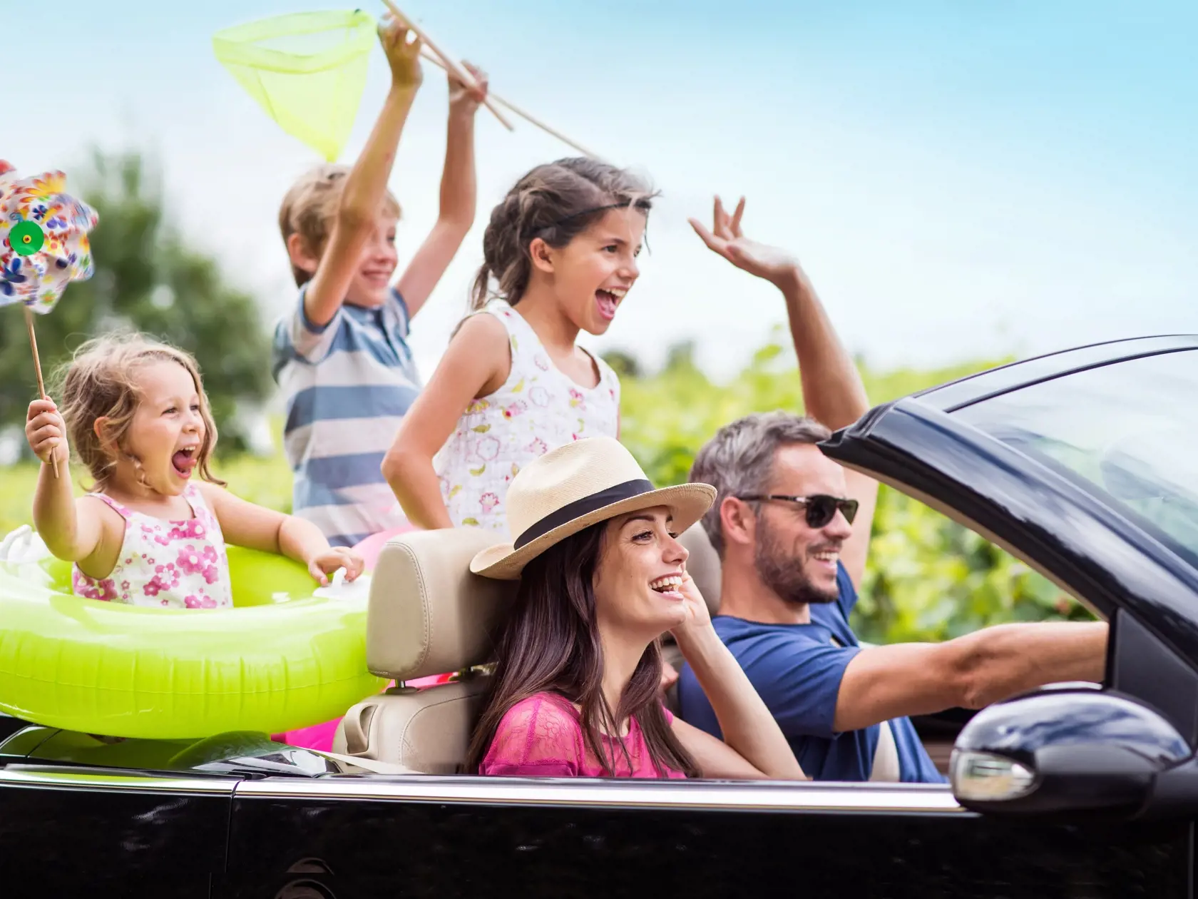 A,Joyful,Family,,In,A,Convertible,Car,,Goes,On,Holiday