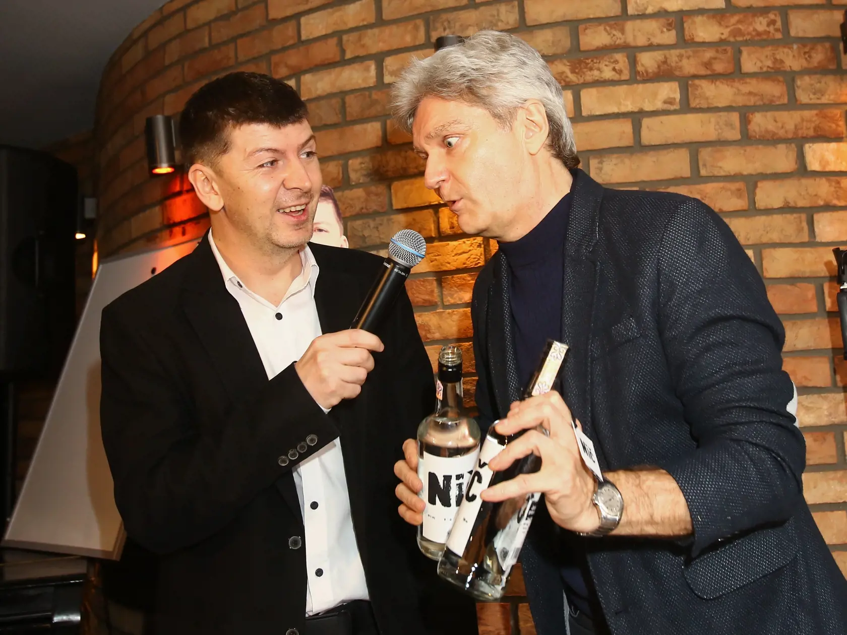 Na snimke Andrej Bican a Stefan Skrucany pocas krstu novej Bicanovej vodky s nazvom NIC.