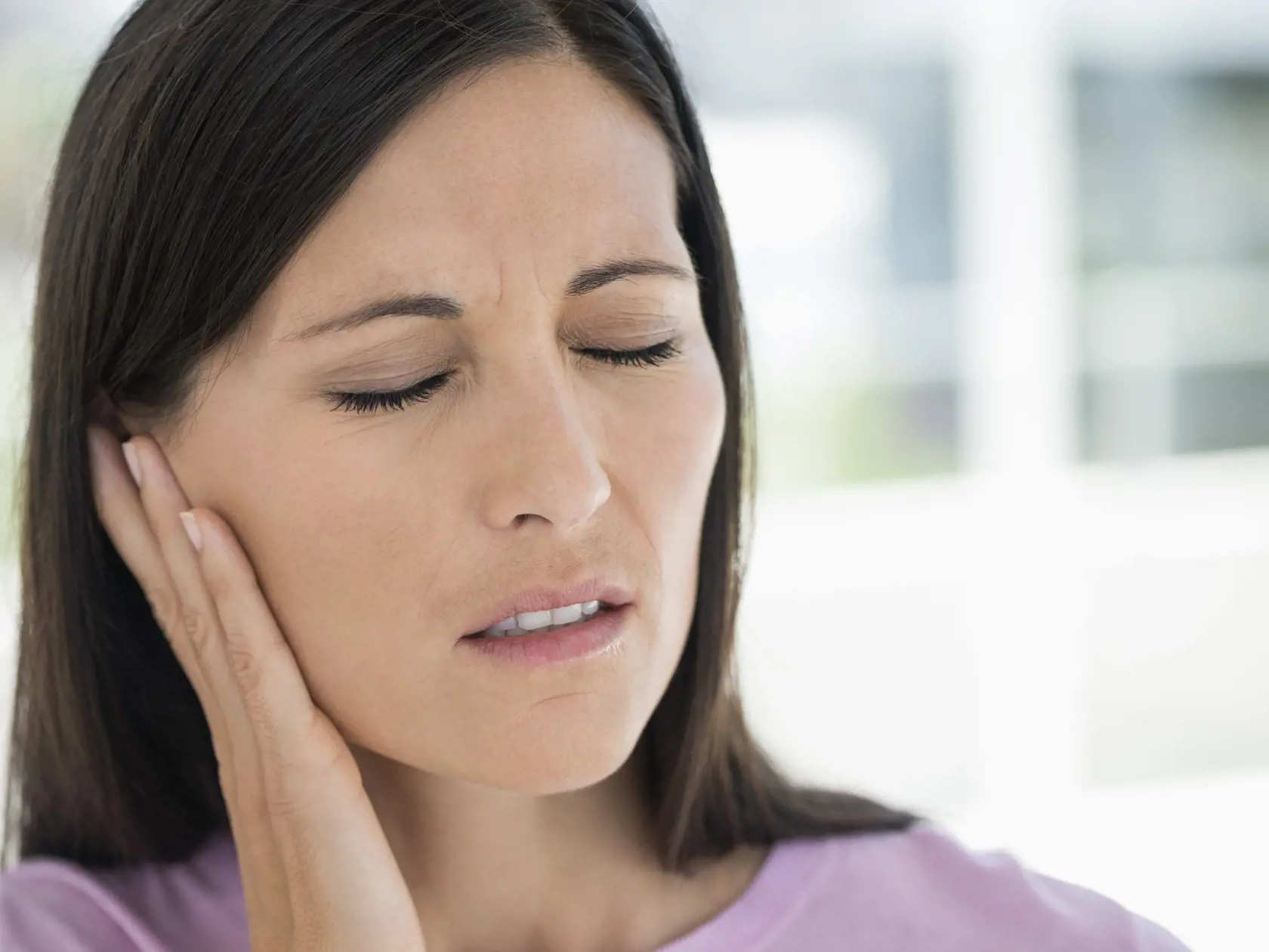 Woman suffering from an ear ache