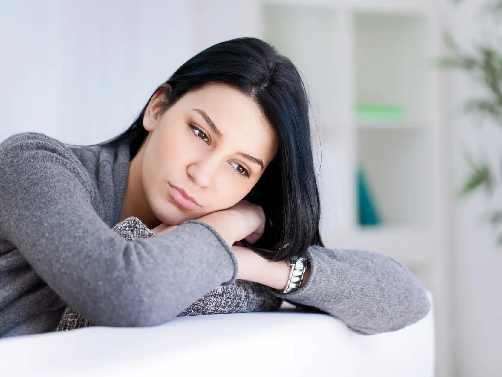 Lonely sad woman deep in thoughts