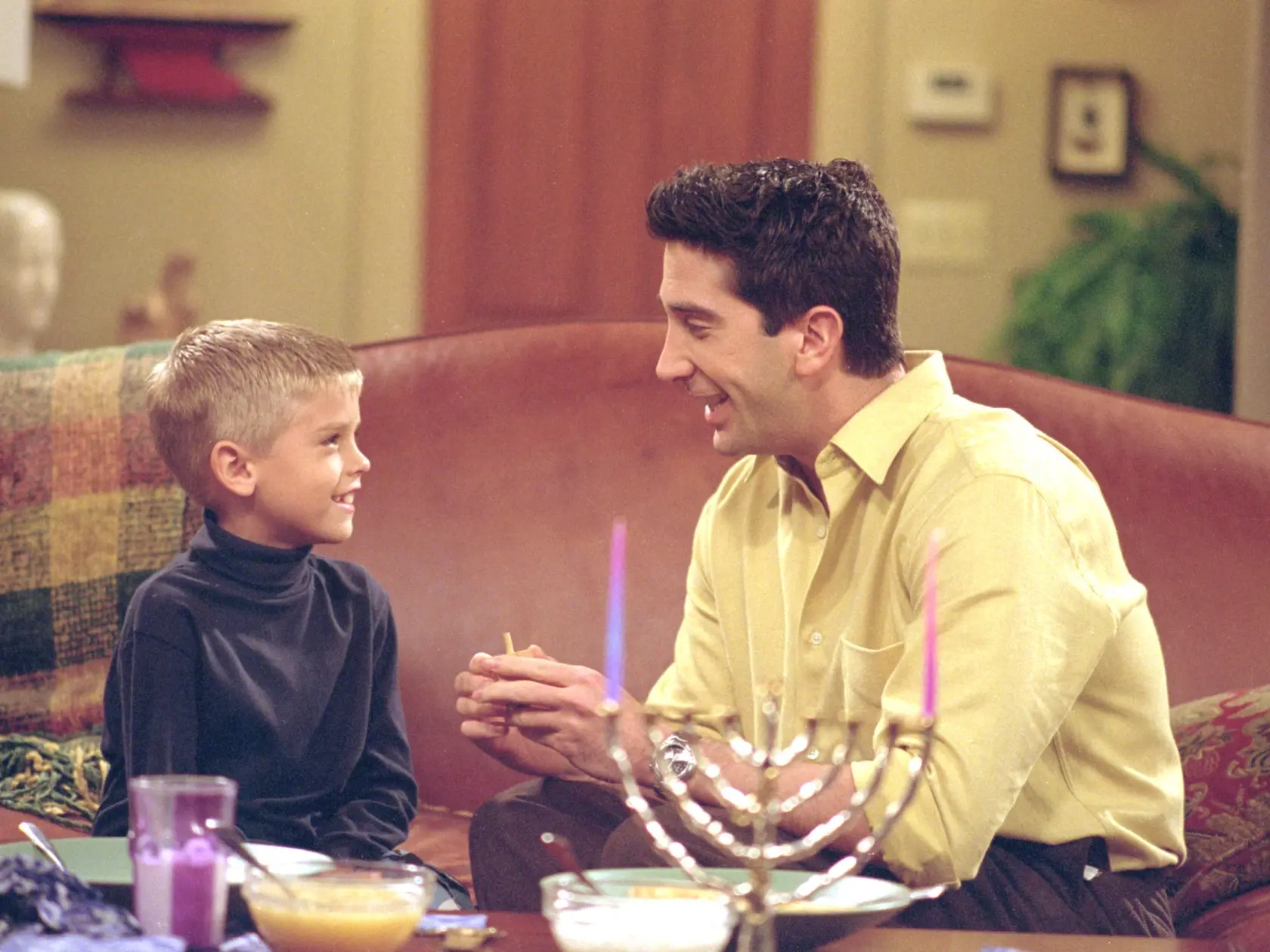 385848 23: Actors Cole Mitchell Sprouse (Big Daddy) as Ben and David Schwimmer as Ross Geller star in NBC's comedy series "Friends" episode "The One with the Holiday Armadillo." Ross has Ben for the holidays and decides that this season, they will celebrate Chanukah instead of Christmas. (Photo by Warner Bros. Television)