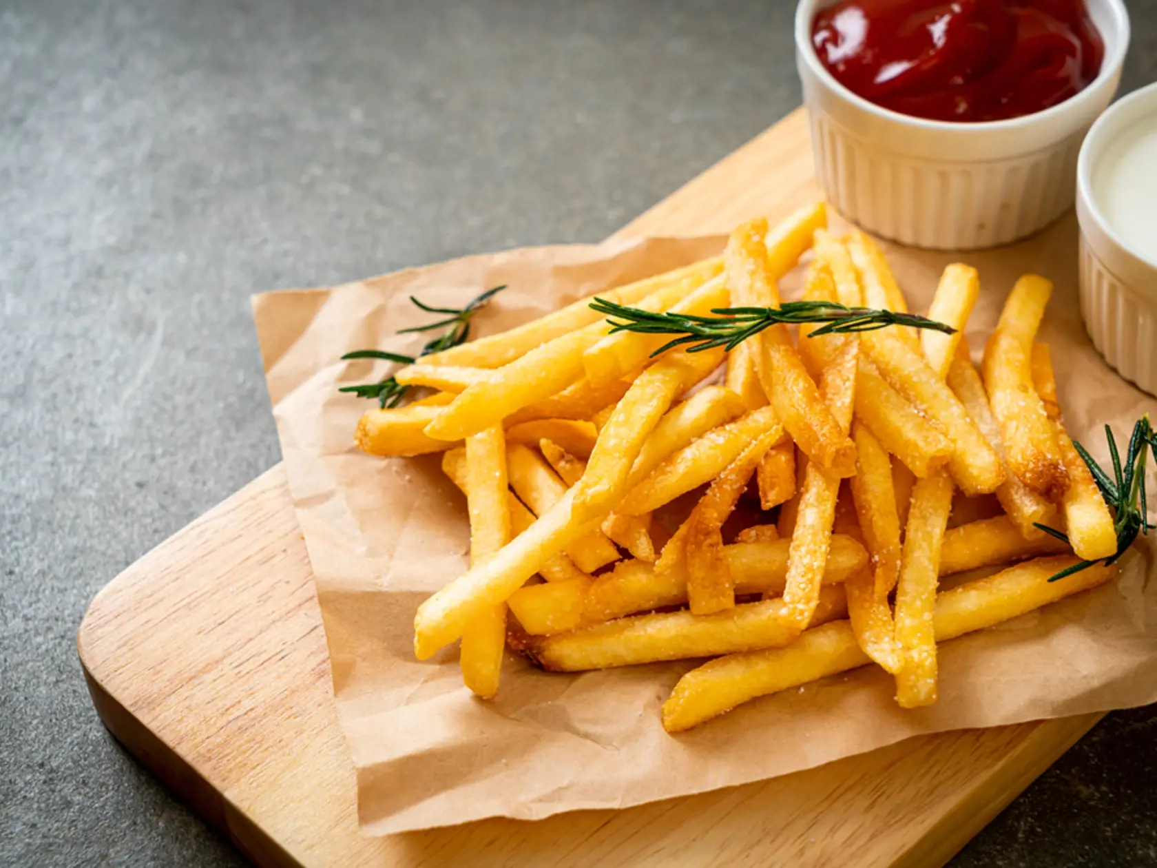 French,Fries,Or,Potato,Chips,With,Sour,Cream,And,Ketchup