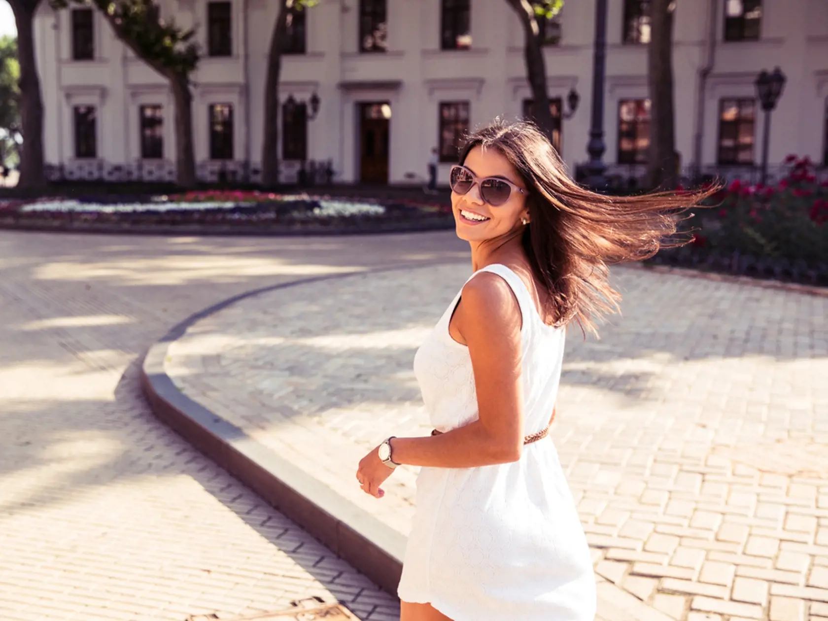 Happy,Woman,In,Sunglasses,And,Dress,Walking,Outdoors.,Looking,At