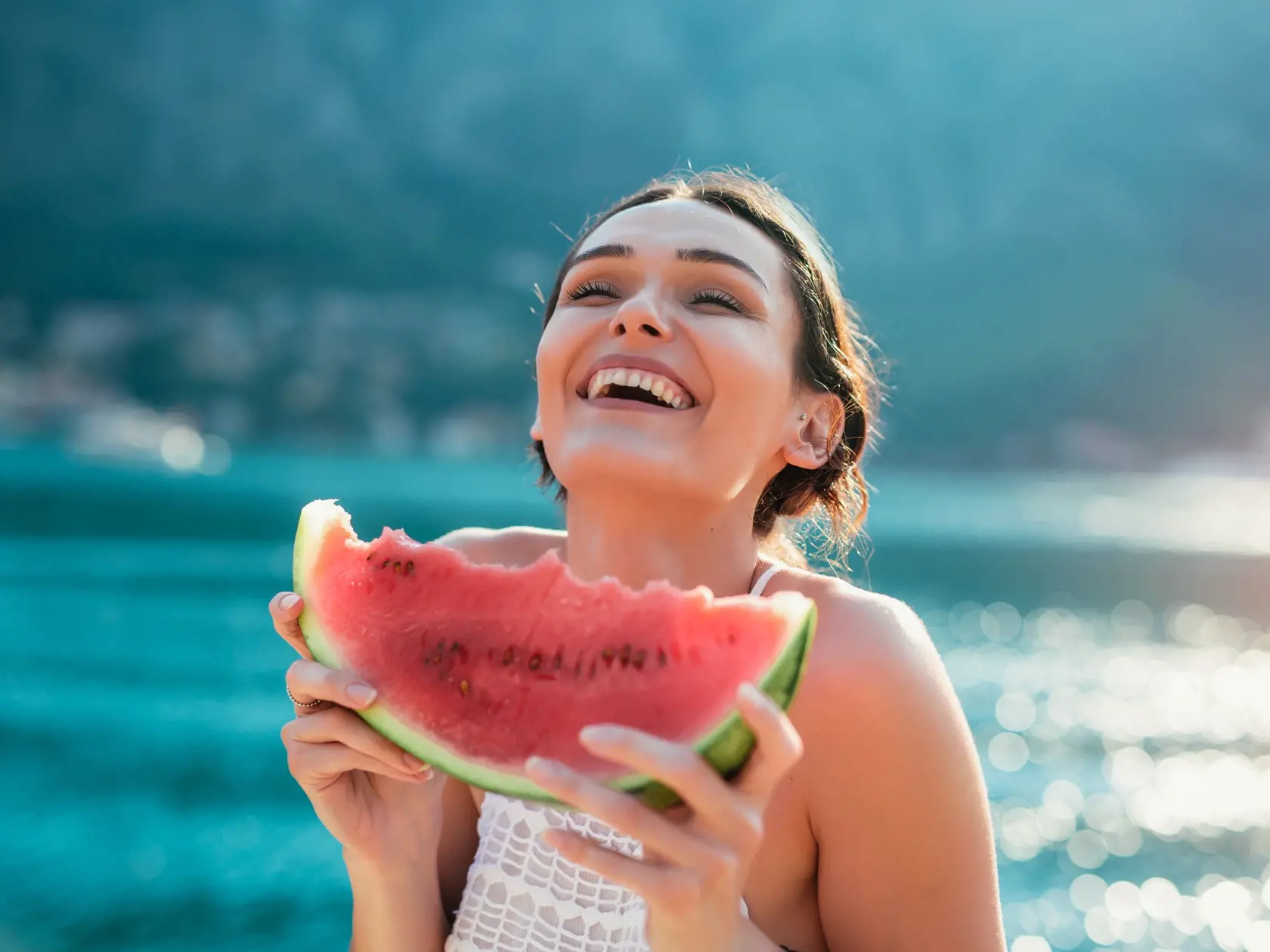 Attractive,Young,Woman,On,The,Beach,Eating,Watermelon