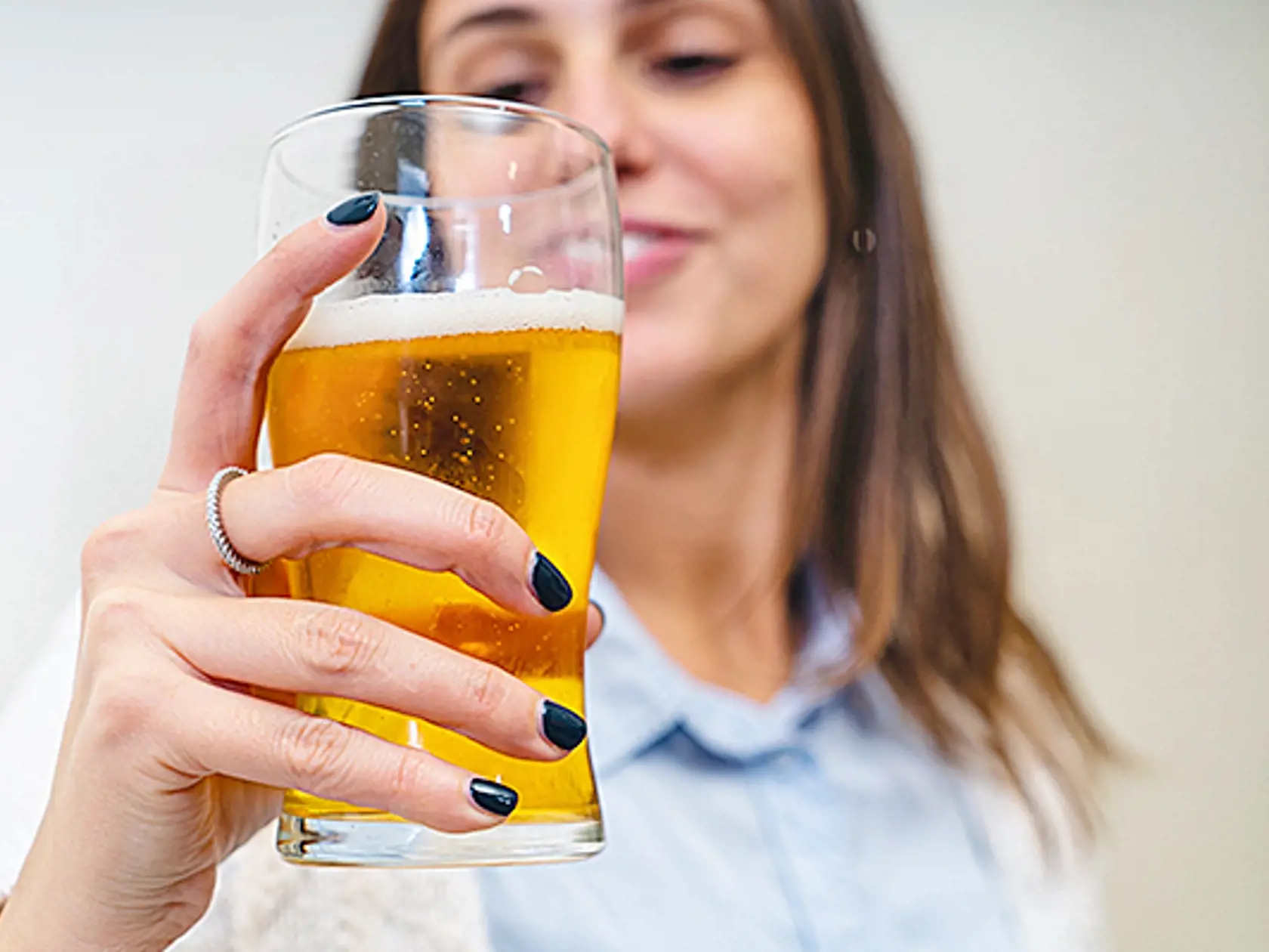 Beautiful,Happy,Woman,Holding,A,Glass,Of,Blonde,Beer,Isolated