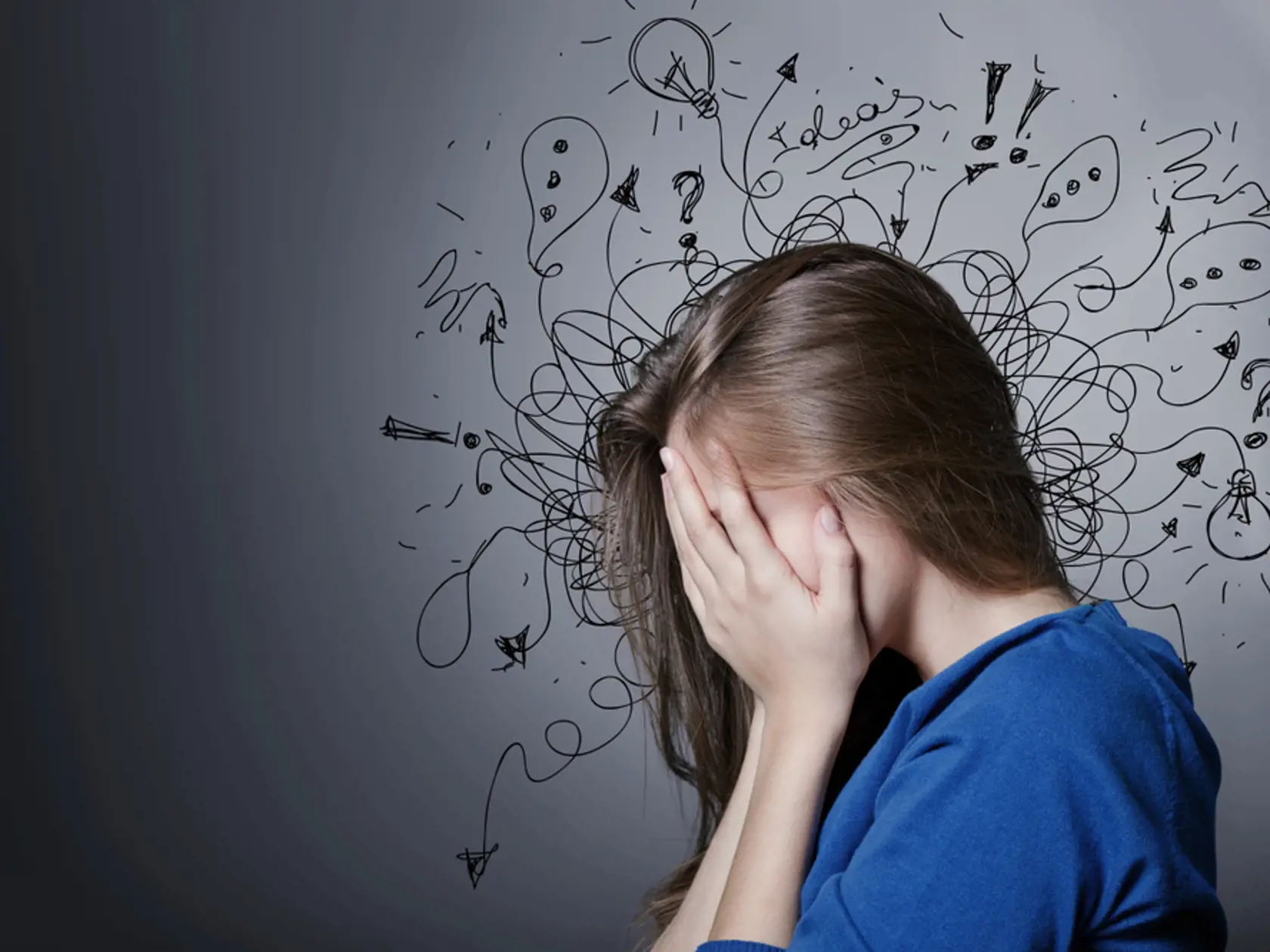 Sad young man with worried stressed face expression and brain melting into lines question marks. Obsessive compulsive, adhd, anxiety disorders concept