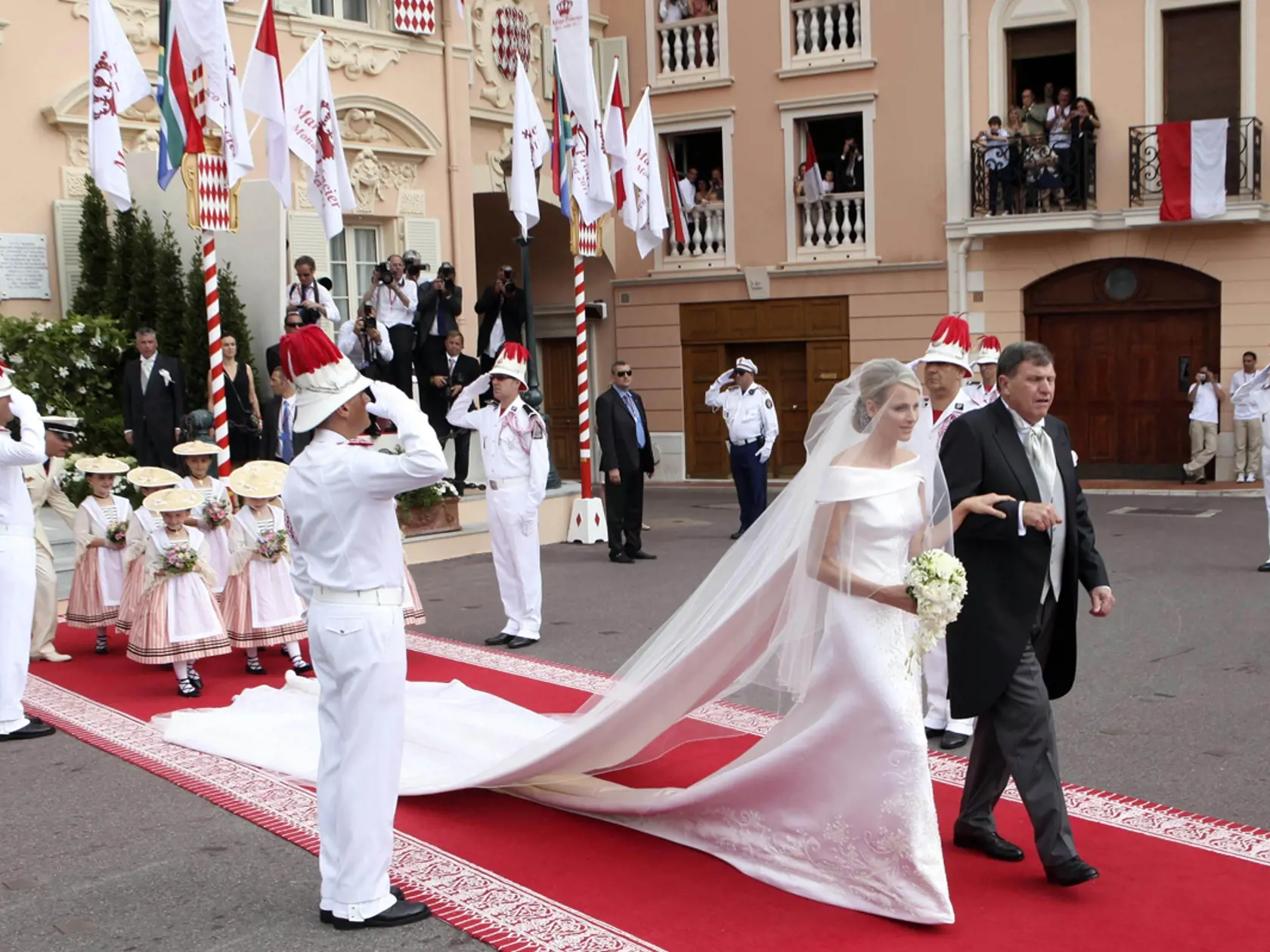 Princess Charlene of Monaco arrives with her father Michael Kenneth Wittstock at the Monaco palace for the religious wedding ceremony of Prince Albert II of Monaco and Charlene Princess of Monaco, Saturday, July 2, 2011. (AP Photo/Joel Ryan, Pool)