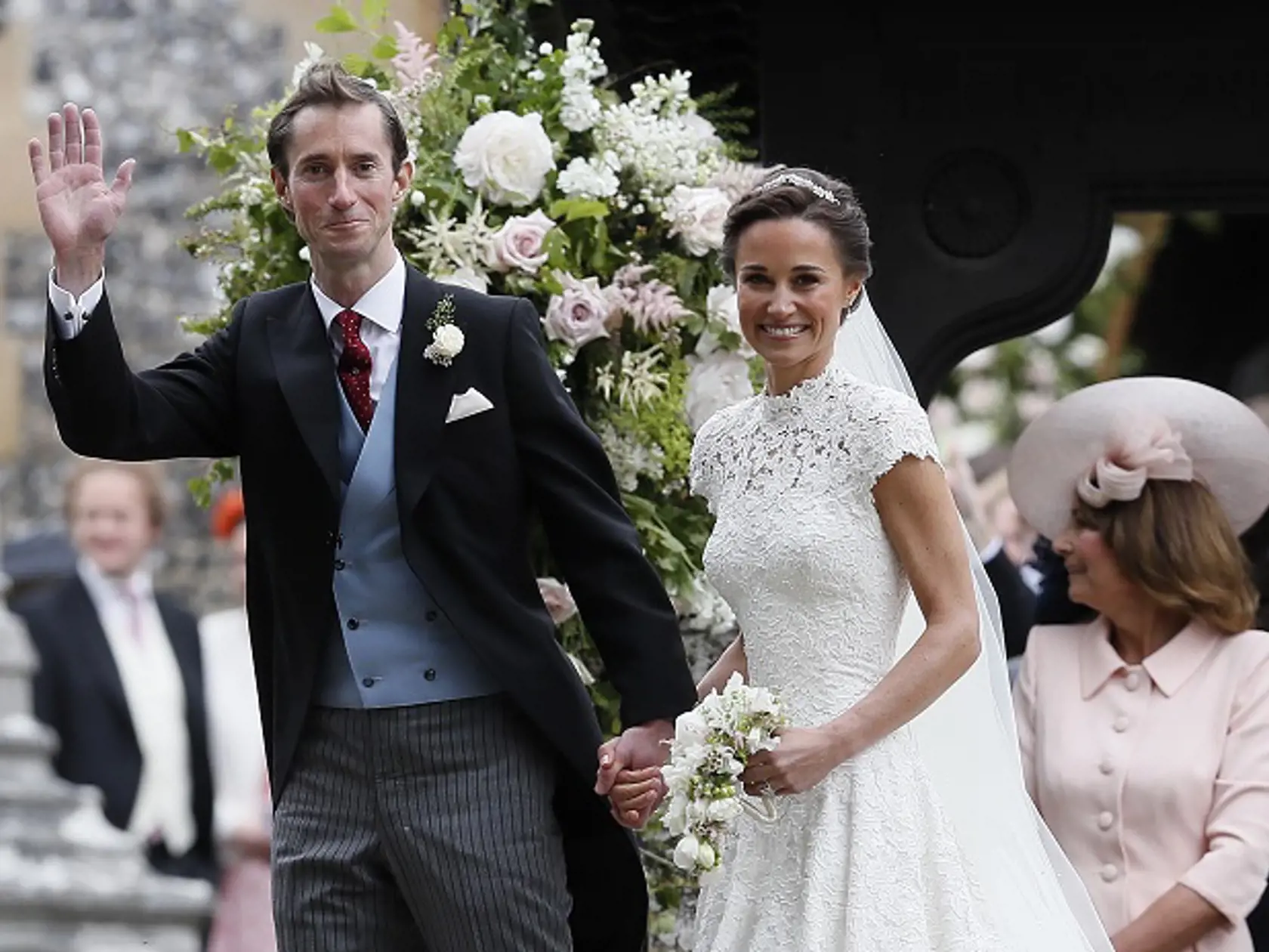 Pippa Middleton and James Matthews smile for the cameras after their wedding at St Mark's Church in Englefield, England Saturday, May 20, 2017. Middleton, the sister of Kate, Duchess of Cambridge married hedge fund manager James Matthews in a ceremony Saturday where her niece and nephew Prince George and Princess Charlotte was in the wedding party, along with sister Kate and princes Harry and William. (AP Photo/Kirsty Wigglesworth, Pool)
