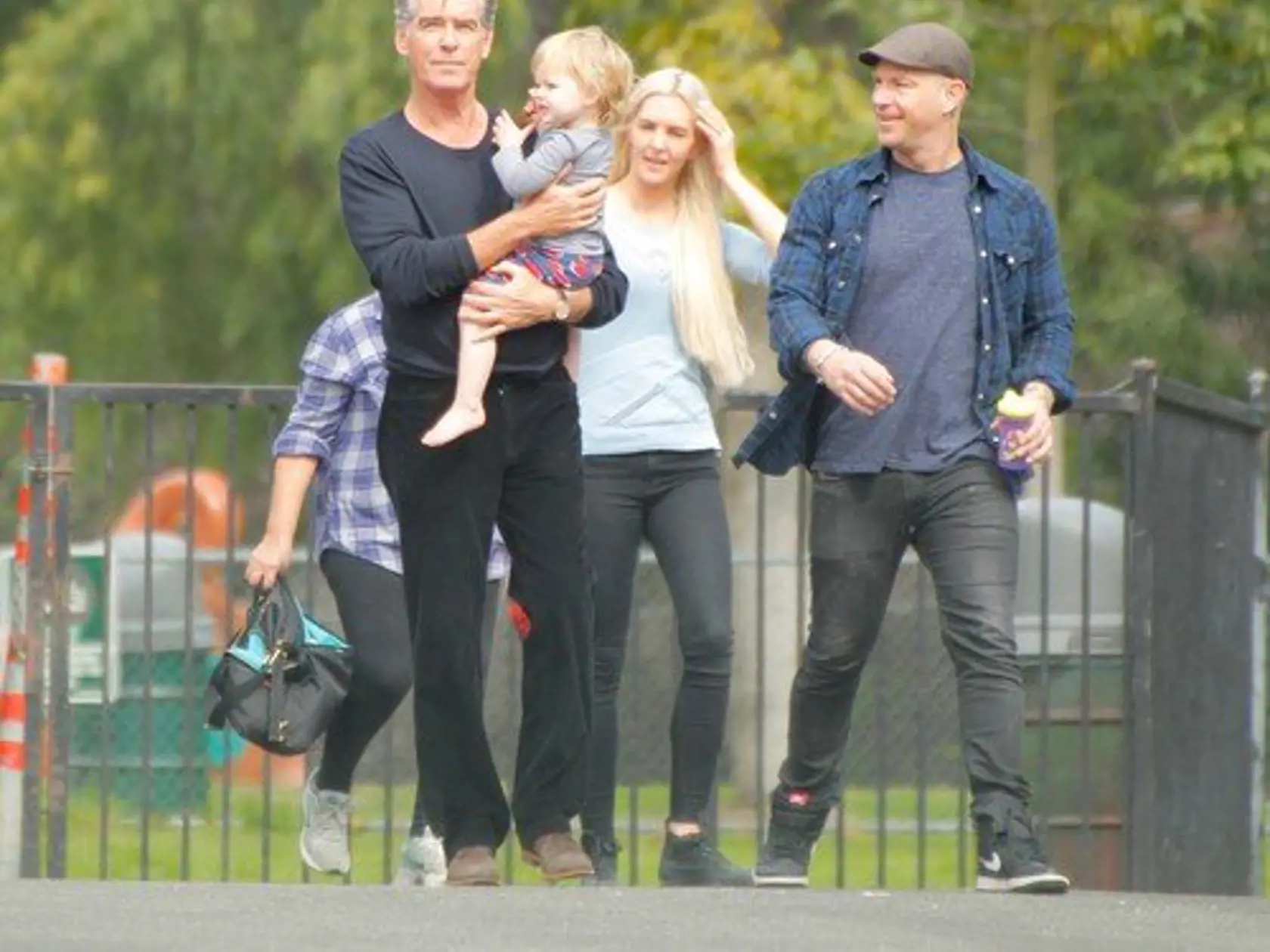 AG_171159 -  - *EXCLUSIVE* Beverly Hills, CA - Pierce Brosnan spends time his family at the park. He is joined by his oldest son Sean, his daughter in law Sanja, and his granddaughter Marley May. The three were spotted grabbing Starbucks before taking Marley to the park. The adults spend time together as they push the baby on the swing.    Pictured: Pierce Brosnan, Sean Brosnan, Sanja Banic, Marley May Cassandra   16 FEBRUARY 2017, Image: 321254833, License: Rights-managed, Restrictions: , Model