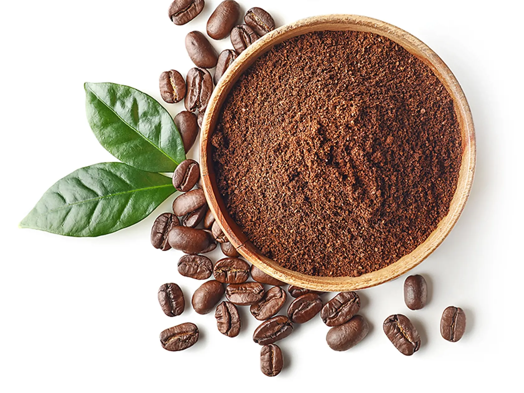 Bowl of ground coffee and beans isolated on white background, top view