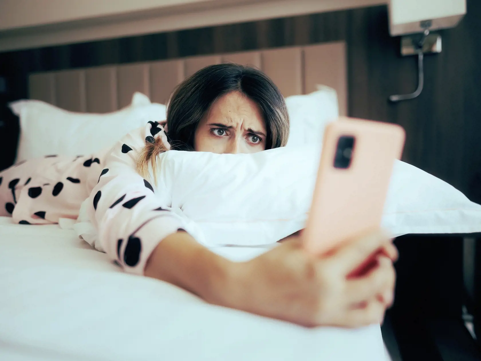 Worried,Woman,Looking,At,Her,Phone,Lying,In,Bed.,Depressed