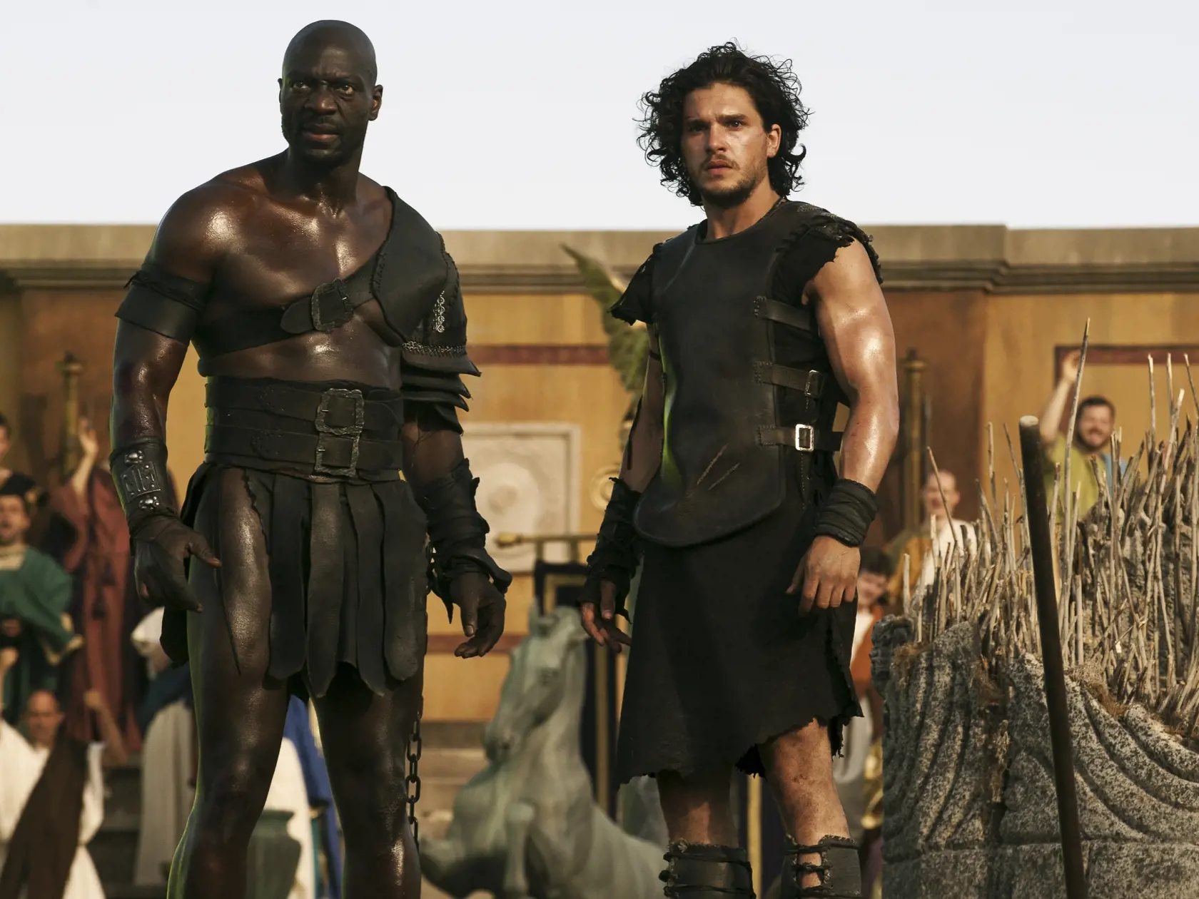 Milo (Kit Harington) and Atticus (Adewele Akinnouye-Agbaje) defeat the "Roman Soldiers" in the Amphitheatre in TriStar Pictures' POMPEII.
