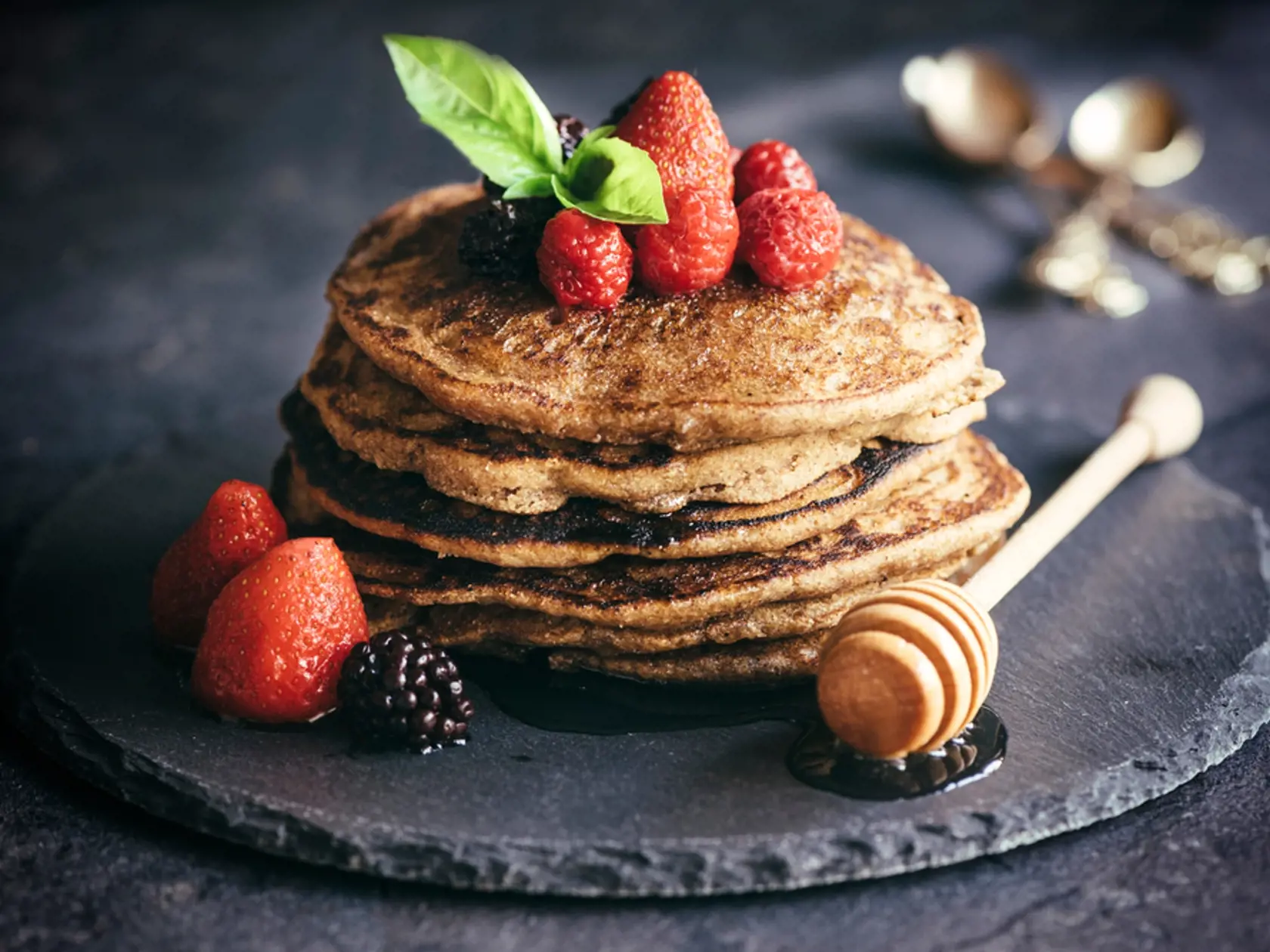 Buckwheat pancakes with berry fruit and honey.Selective focus
