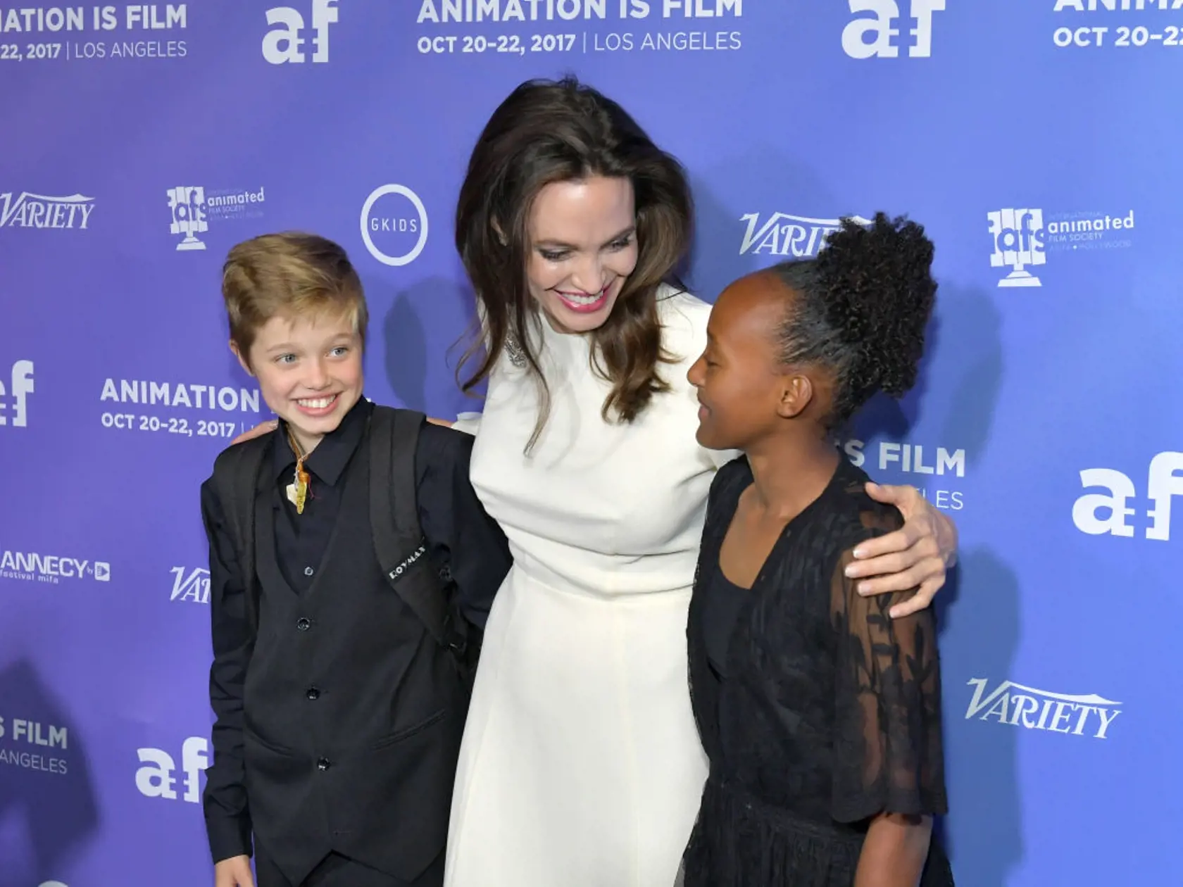 HOLLYWOOD, CA - OCTOBER 20: Shiloh Jolie-Pitt, Angelina Jolie and Zahara Jolie-Pitt attend the Premiere Of Gkids' "The Breadwinner" at TCL Chinese 6 Theatres on October 20, 2017 in Hollywood, California.  (Photo by Neilson Barnard/Getty Images)