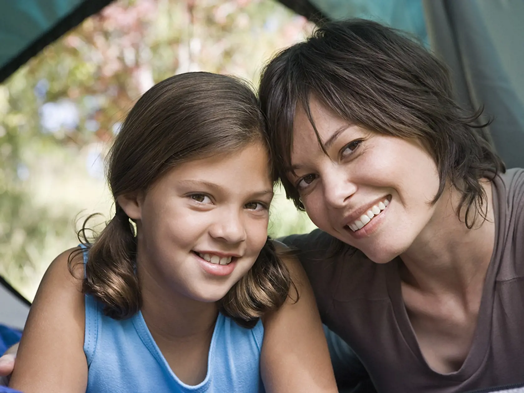 Mother and daughter in tent