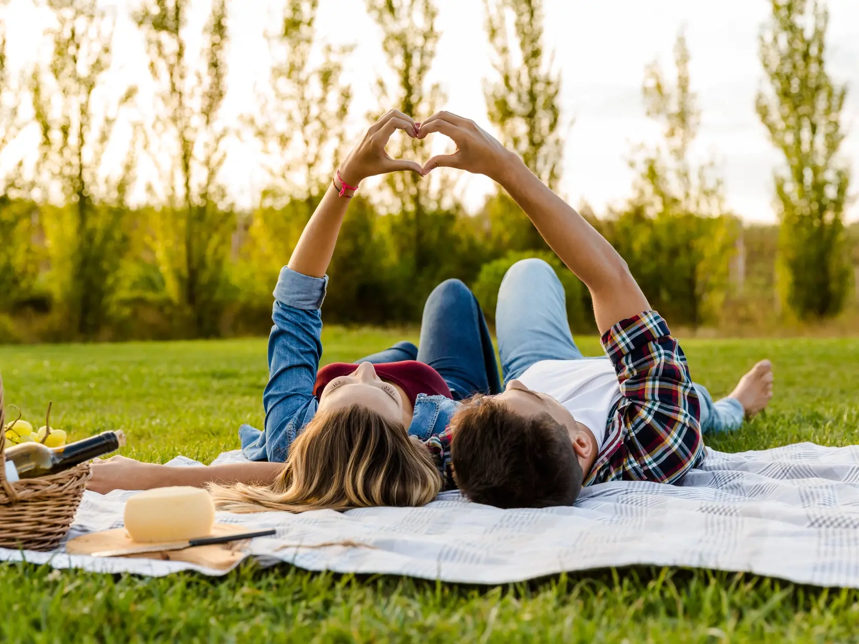 Happy,Couple,In,Love,,Lying,On,The,Park,And,Enjoying