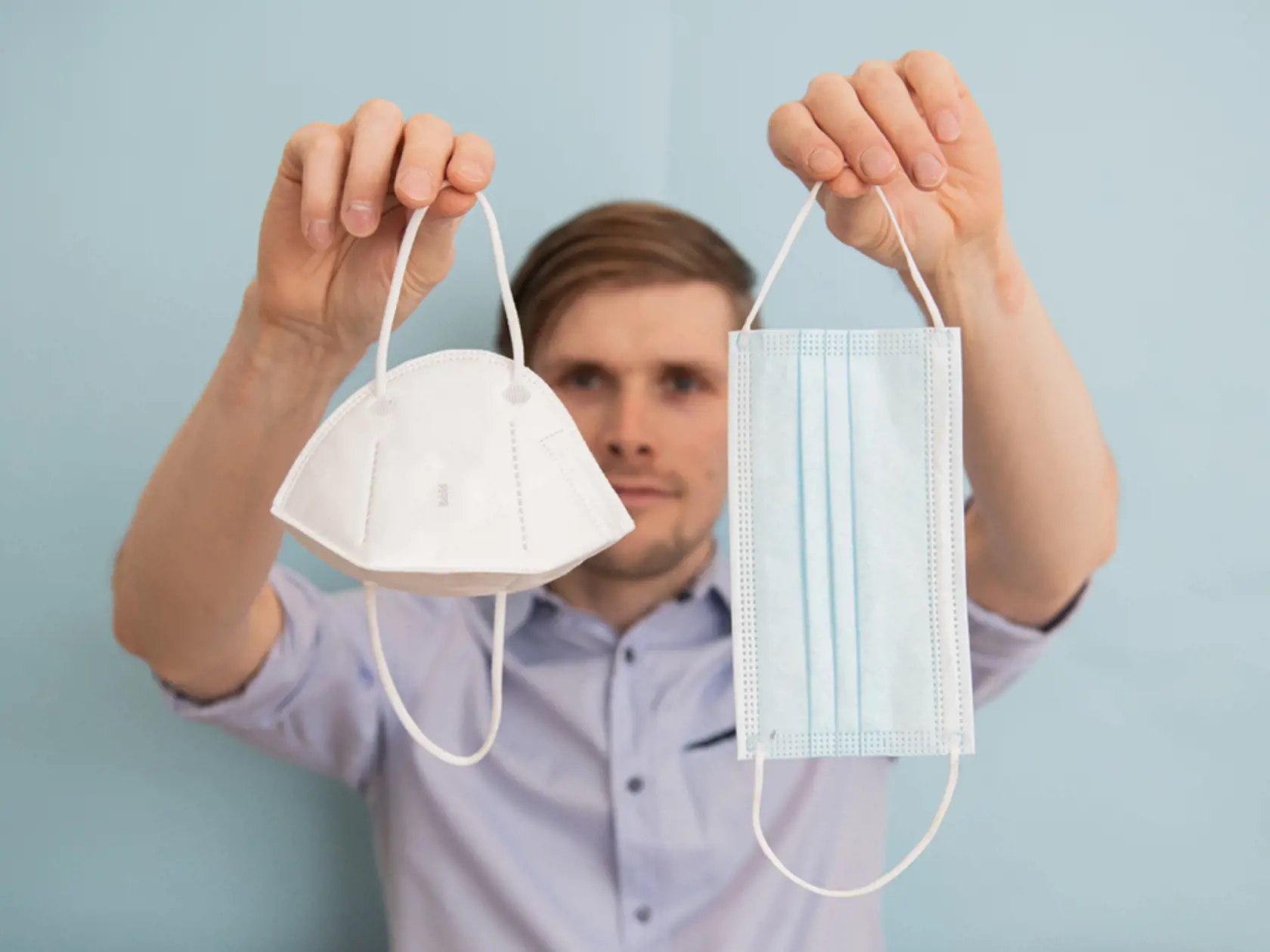 Man,Holding,Ffp2,Respirator,And,Surgical,Face,Masks.,Time,To