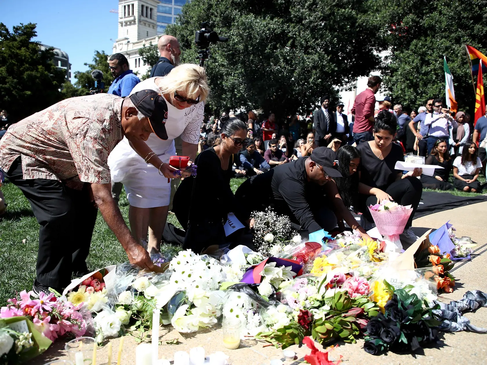 AUCKLAND, NEW ZEALAND - MARCH 16: People place flowers and messages of condolence as a large crowd gathers in Aotea Square for a memorial to remember the victims of the Christchurch mosque shootings on March 16, 2019 in Auckland, New Zealand. At least 49 people are confirmed dead, with more than 40 people injured following attacks on two mosques in Christchurch on Friday afternoon. 41 of the victims were killed at Al Noor mosque on Deans Avenue and seven died at Linwood mosque. Another victim di