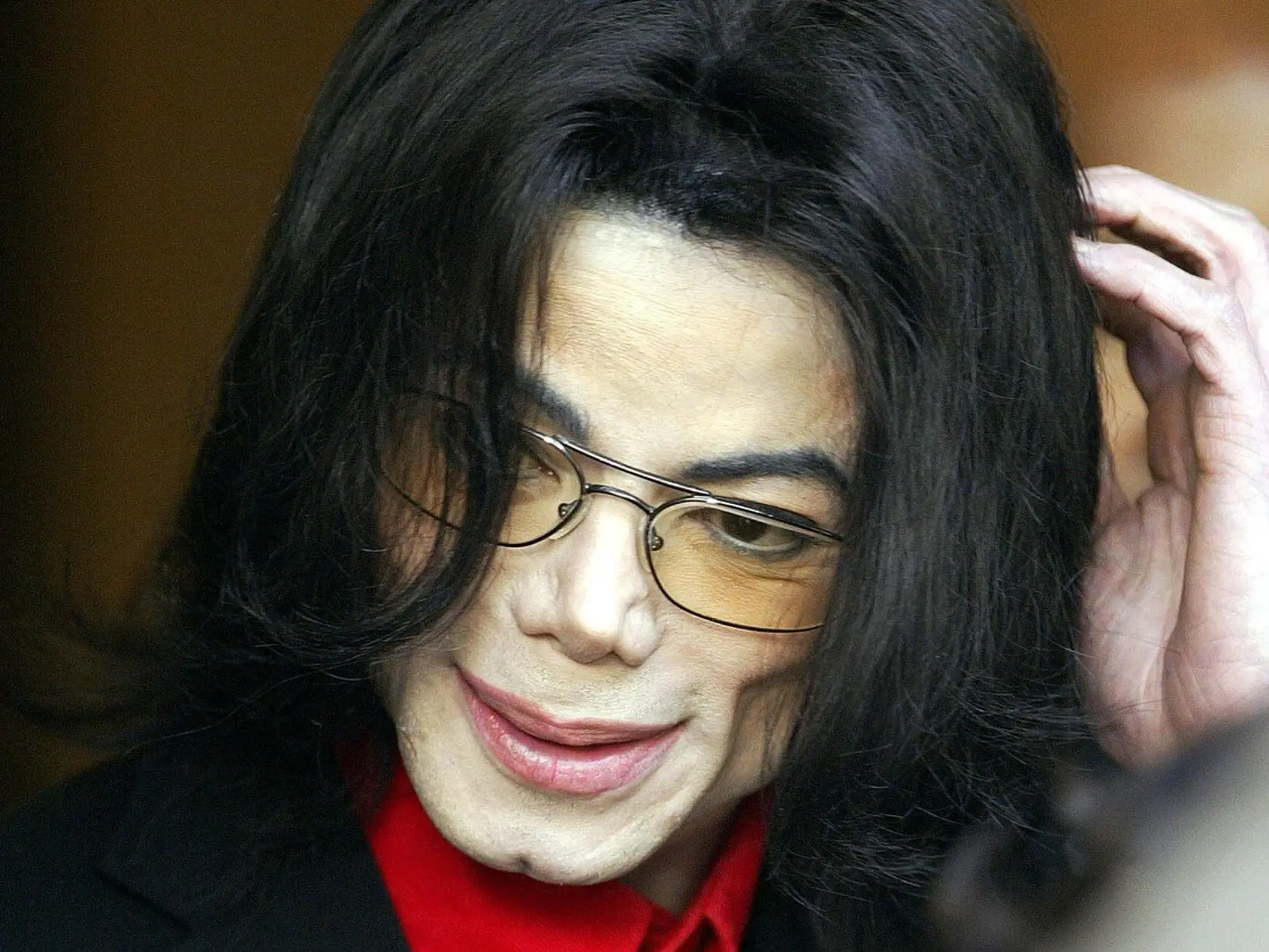 US pop star Michael Jackson exits the Santa Barbara County Courthouse after day 19 of his child molestation trial in Santa Maria, California, Thursday, 24 March, 2005. Prosecutors are battling to convince jurors that prints belonging to the faded superstar and his now 15-year-old accuser on a pornographic magazine meant that Jackson used the porn to "groom" his alleged victim for abuse. But Jackson lawyer Robert Sanger suggested the accuser had handled the magazine at a court hearing between the