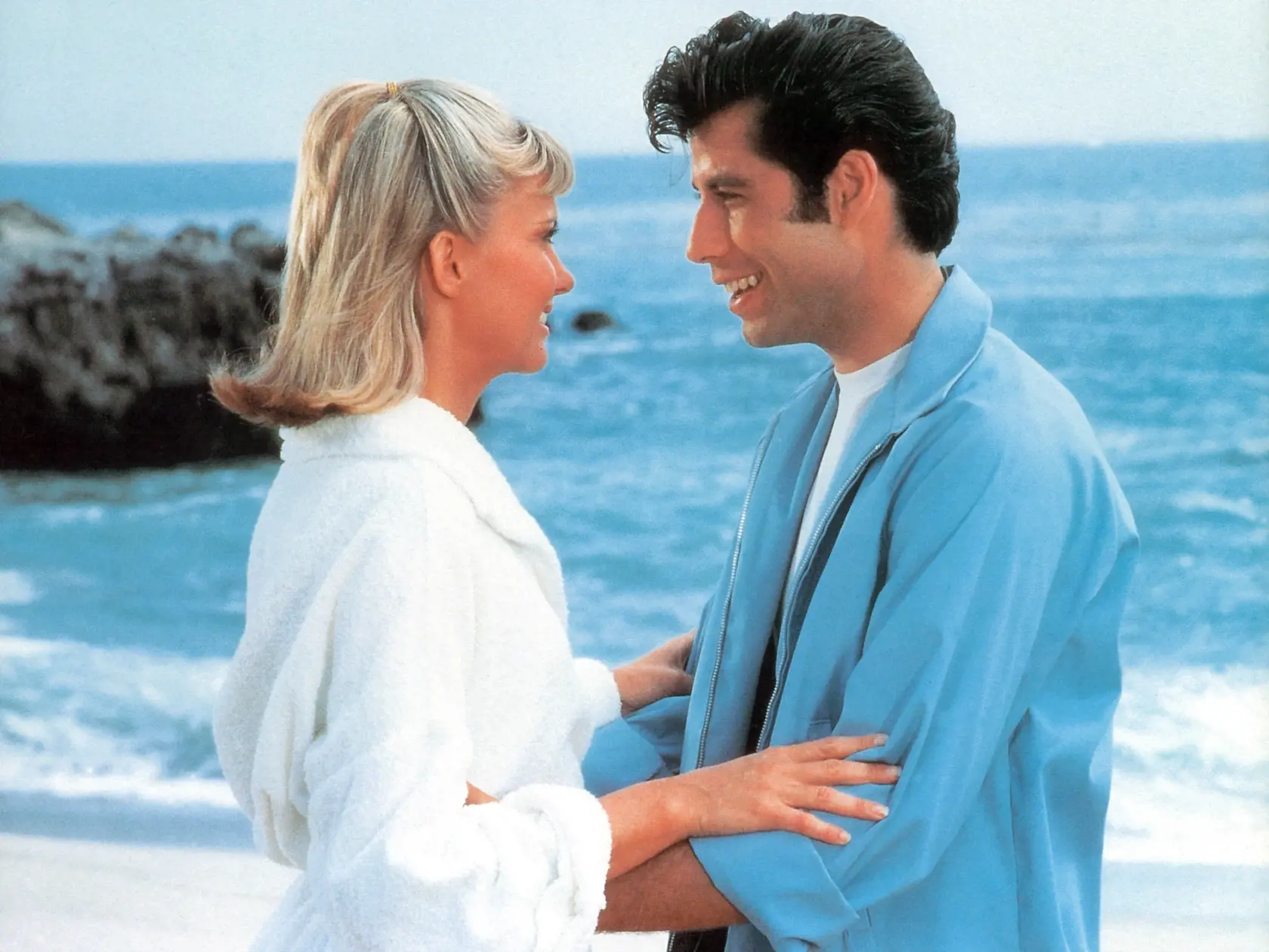 Olivia Newton-John and John Travolta on the beach in a scene from the film 'Grease', 1978. (Photo by Paramount/Getty Images)