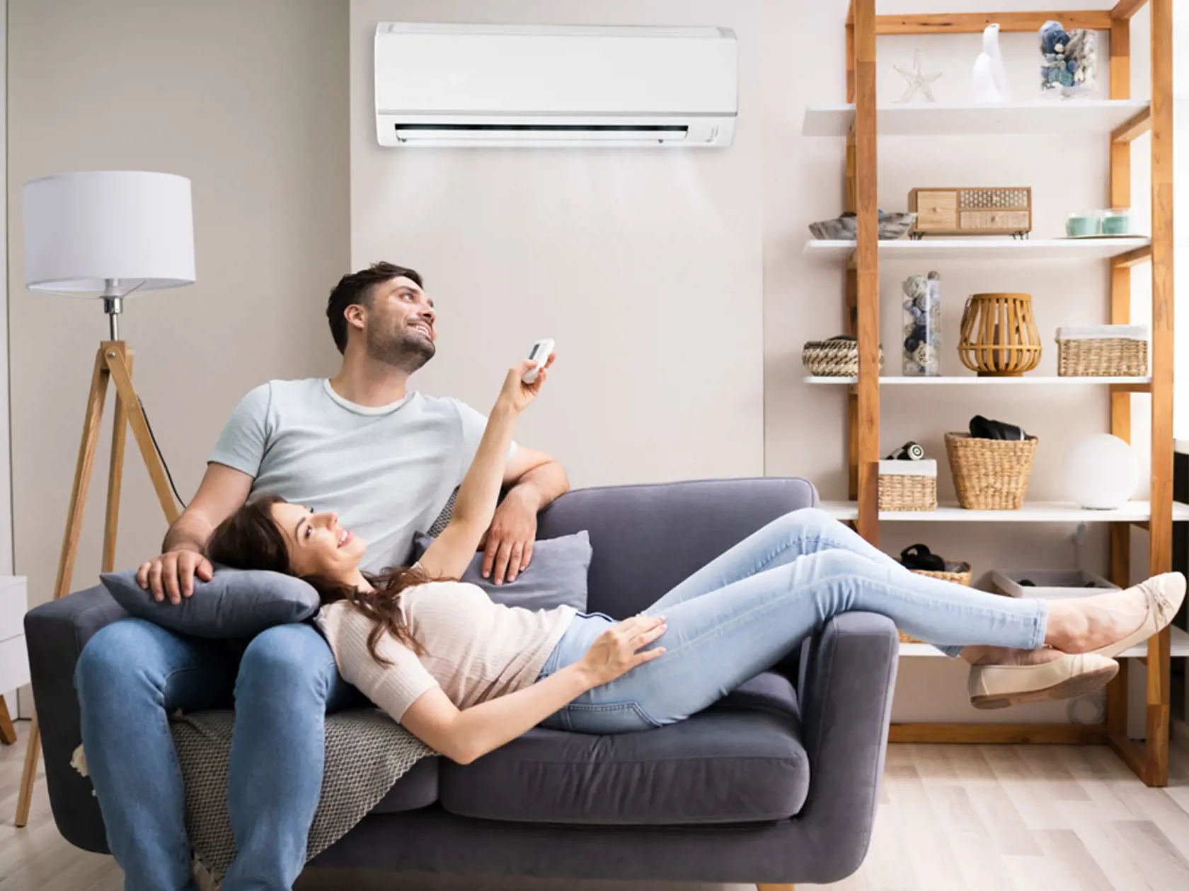 Happy,Woman,Holding,Air,Conditioner,Remote,Control