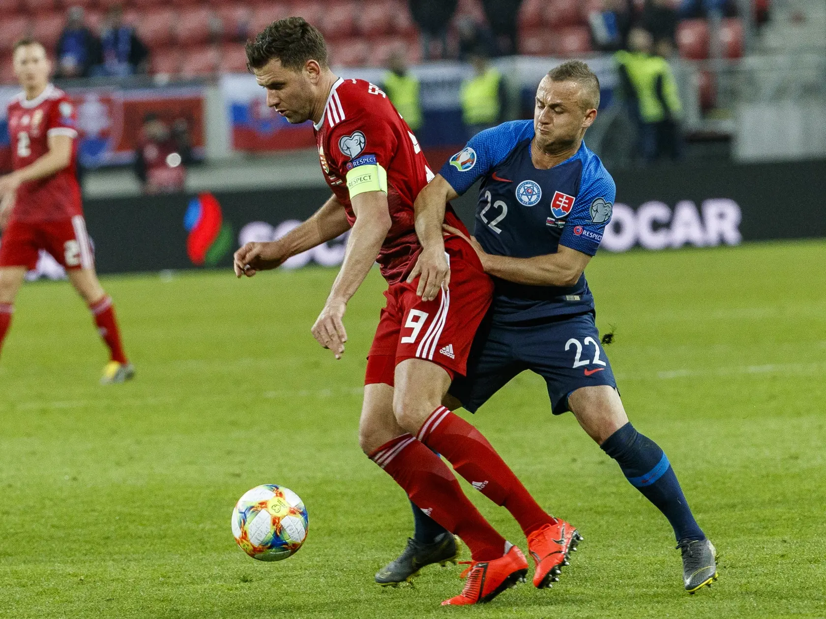 Na snímke Stanislav Lobotka a Ádám Szalai počas kvalifikačného zápasu Majstrovstiev Európy vo futbale 2020 medzi Slovenskom a Maďarskom.