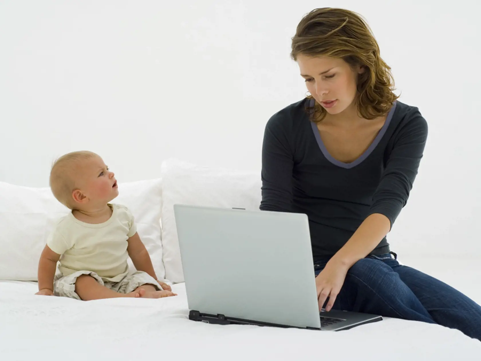 Mother with baby and laptop
