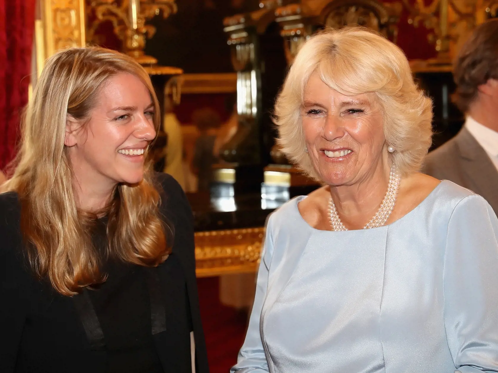LONDON, ENGLAND - JULY 12:  Camilla, Duchess of Cornwall laughs with her daughter Laura Lopes as she hosts the 30th Anniversary Garden Party for the National Osteoporosis Society in St James Palace on July 12, 2016 in London, England. Due to inclement weather the event was moved indoors. The Duchess of Cornwall has been connected with the charity for nearly 30 years.  (Photo by Chris Jackson/Getty Images)