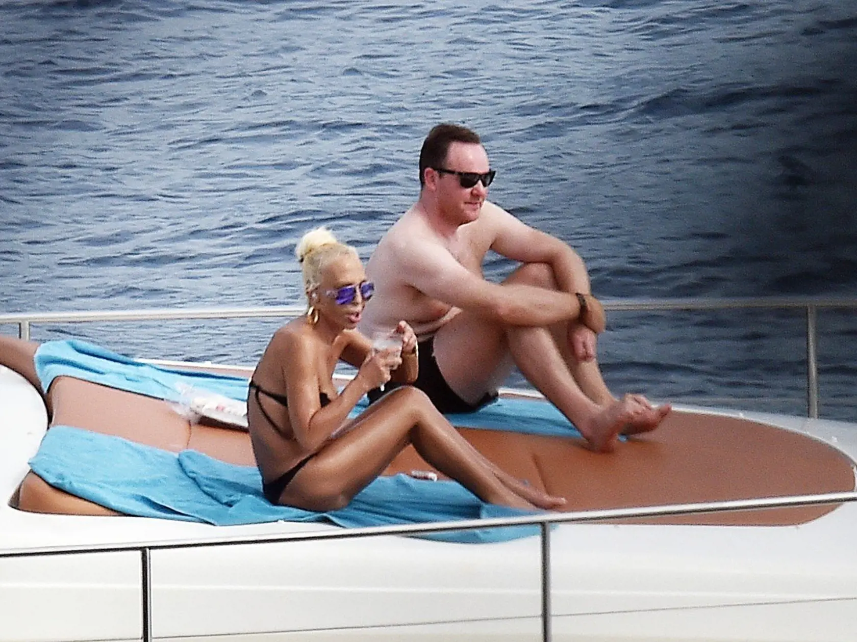 4 Sept 2016 - Portofino - Italy  *** PREMIUM EXCLUSIVE - MUST CALL FOR PRICING ***  **DOUBLE SPACE RATES APPLY FOR GERMAN CLIENTS**  *** STRICTLY NOT AVAILABLE FOR ITALY ***  Fashion Designer Donatella Versace and Daughter Allegra Versace Pictured relaxing onboard their Luxury Yacht while enjoying their summer on Holiday in Portofino, Donatella Versace seemed to be having some Trouble with seagulls as she's seen trying to scare them away from her yacht....!, Image: 300053252, License: Rights-man